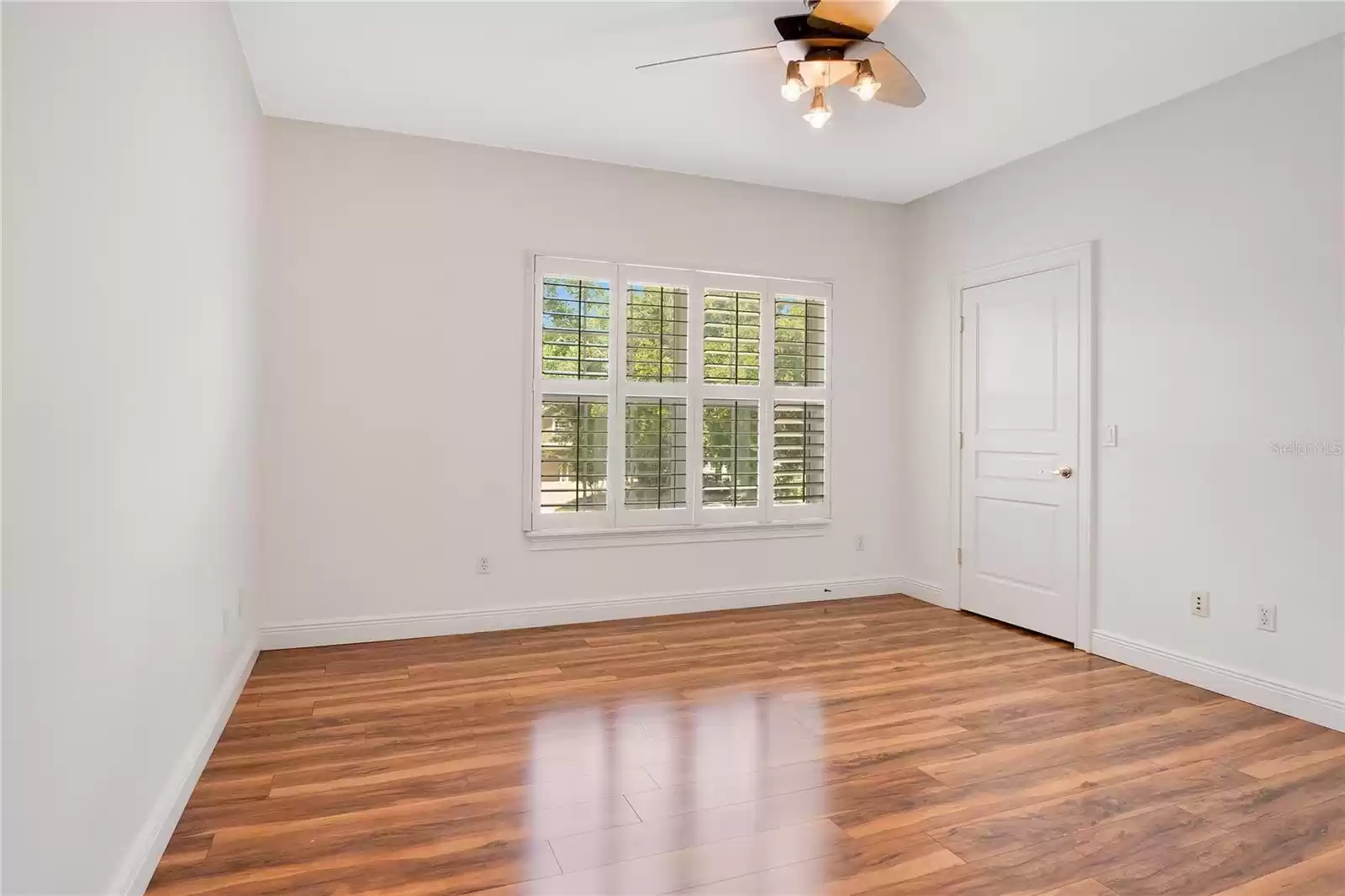 Bedroom 3 with walk-in closet and adjoining hallway bathroom access.