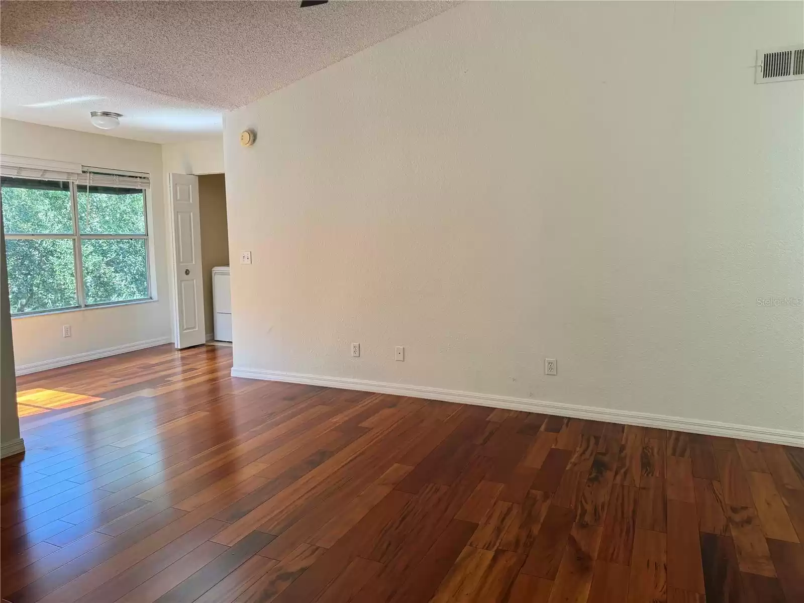 Living room/ Sunroom combo with Laundry.