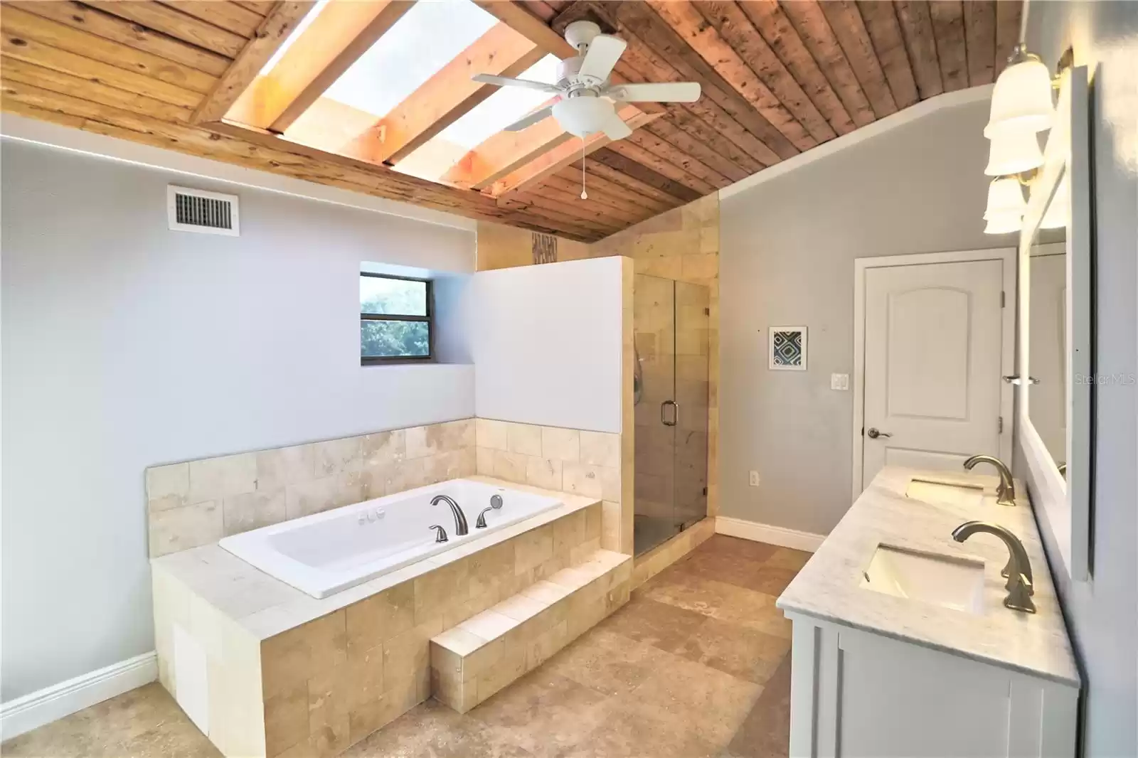 Owner's retreat bath with dual vanity, shower and tub