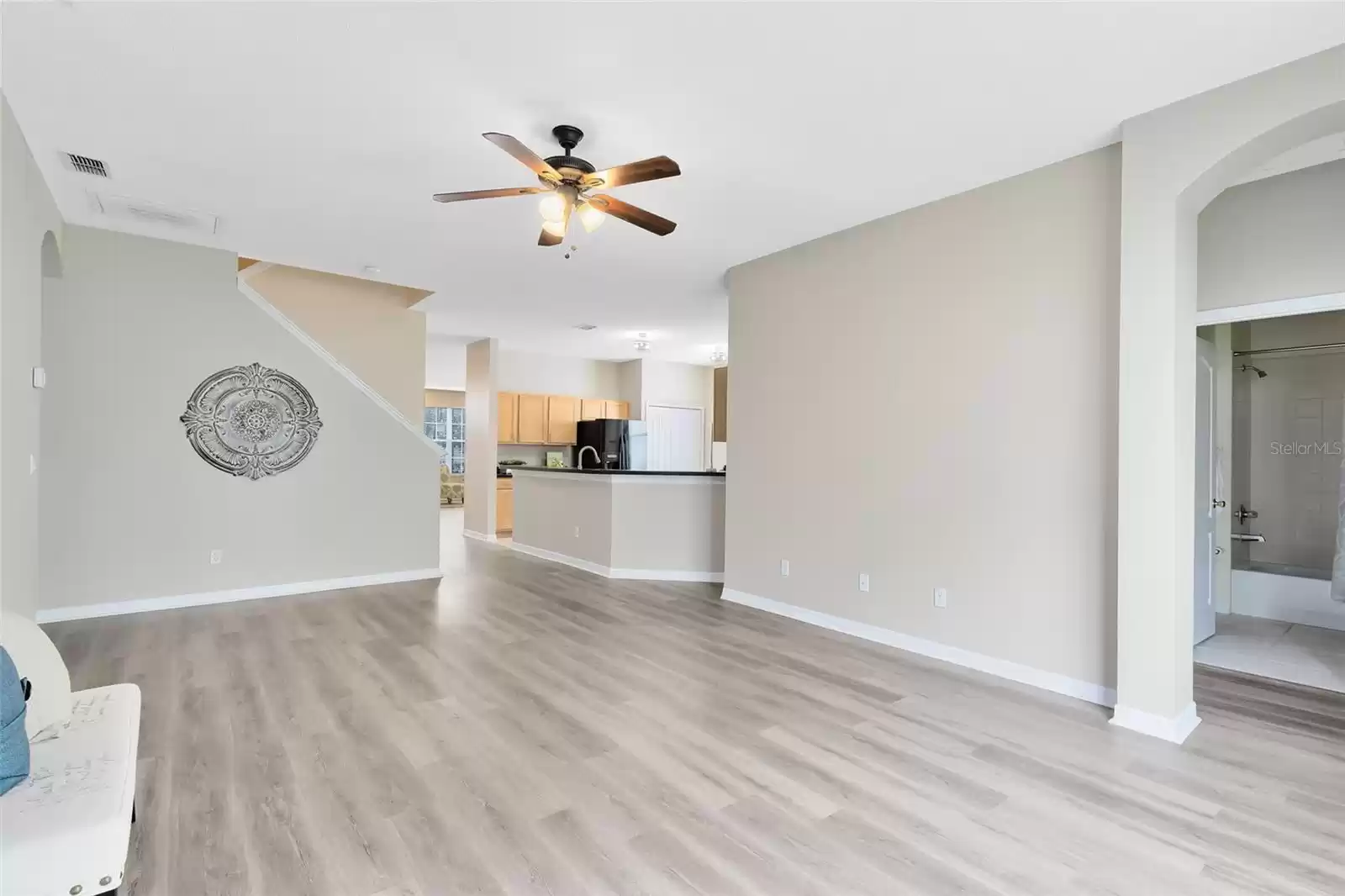 FAMILY ROOM TO THE KITCHEN WITH 2ND BEDROOM AND FULL BATHROOM TO THE RIGHT