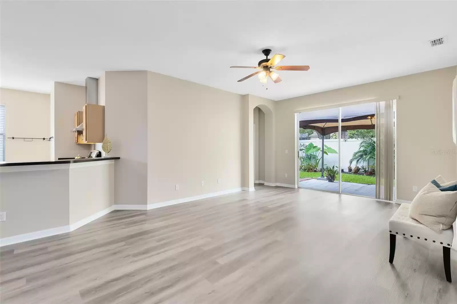 FAMILY ROOM WITH SLIDING DOORS OUT TO THE BACK YARD