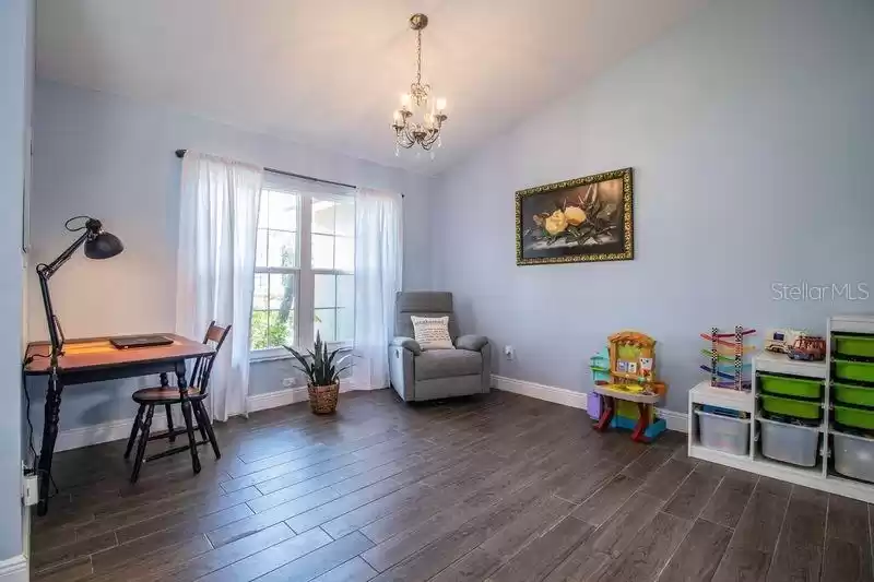 Formal Living room is filled with natural light coming through double pain window.