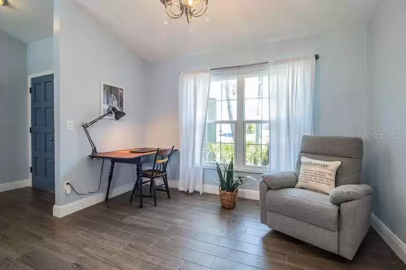 Wood look plank tile floors flow throughout the main areas of the house.