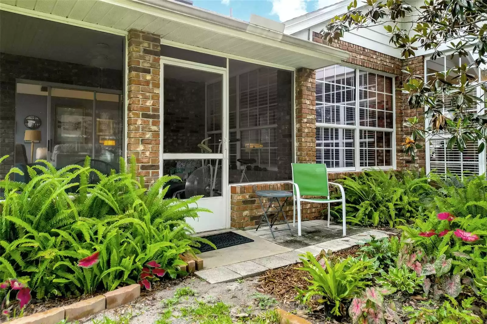 Step outside your screened-in lanai and enjoy the gorgeous, low-maintenance landscaping.