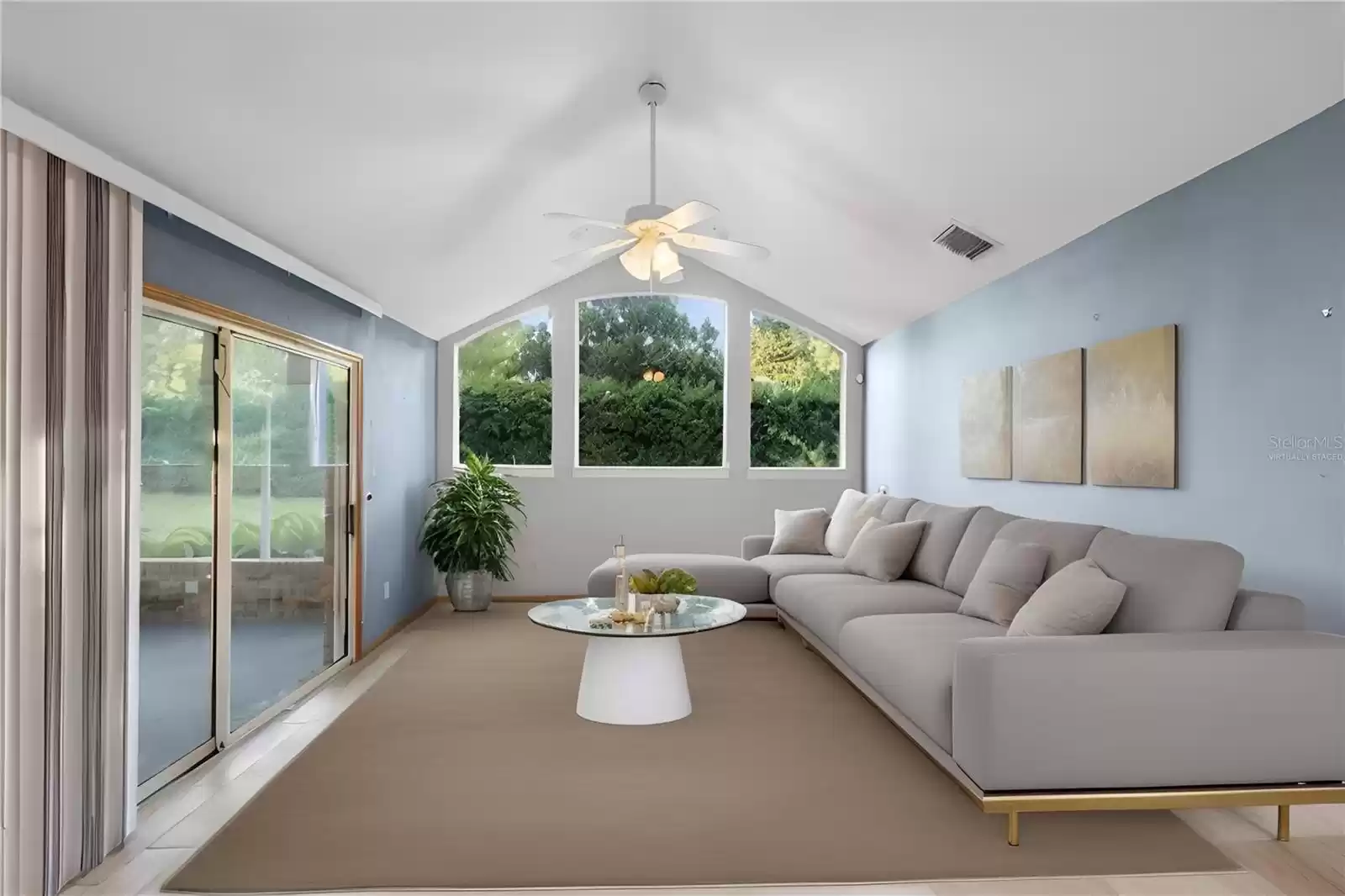 Family room with screened lanai at left.  *Virtually staged* Check out those windows!