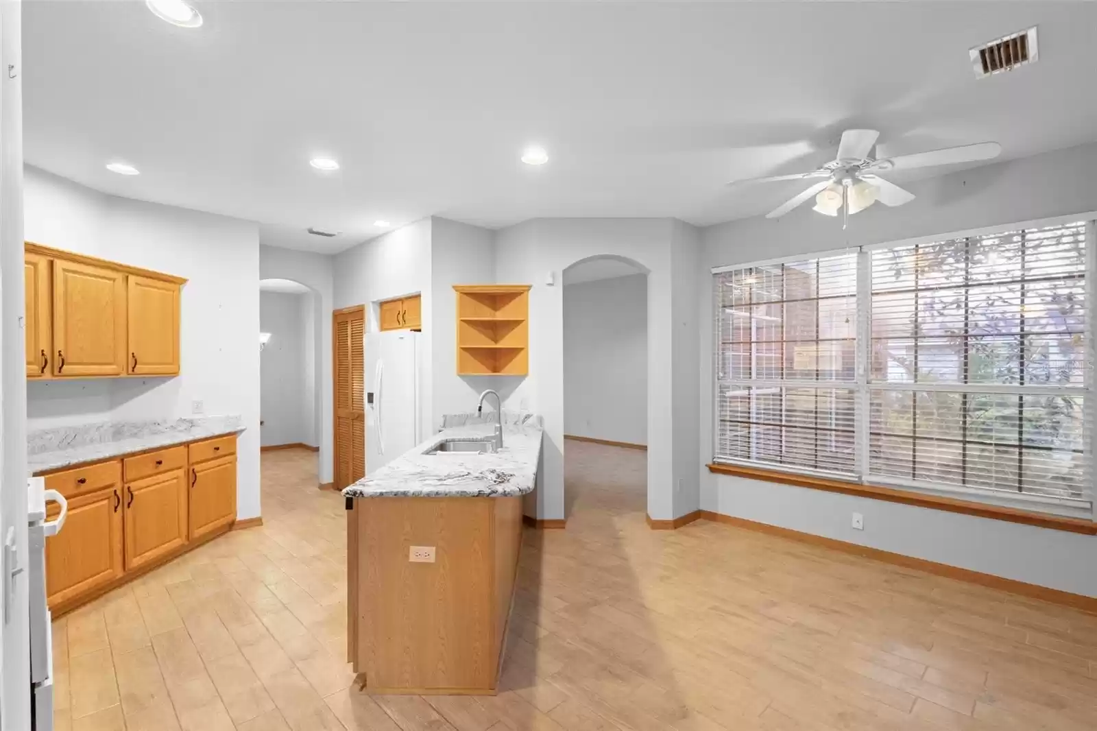 Kitchen at left, breakfast nook at right.