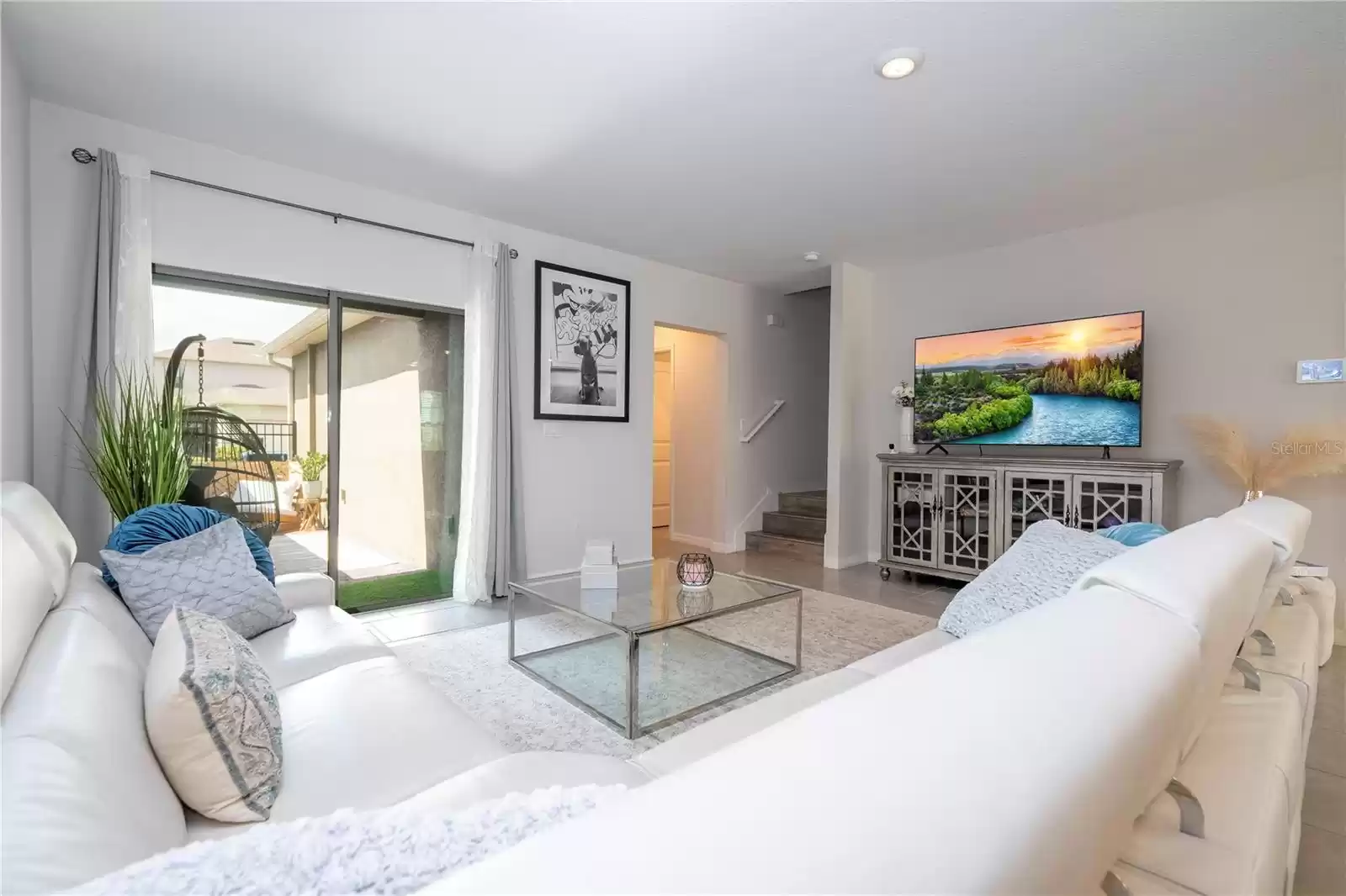 Living room opens to a private covered lanai