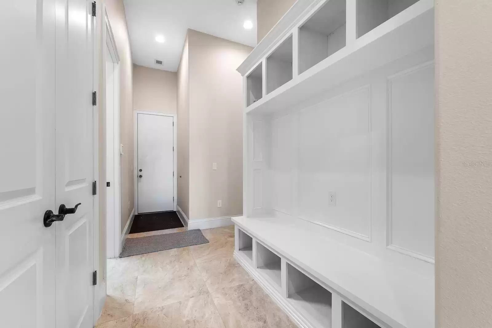 Garage hallway, coat closet and shoe bench