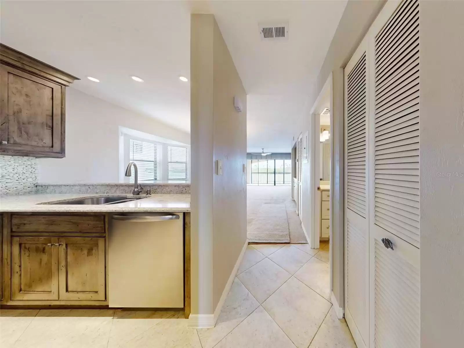 entryway leading into kitchen and living area