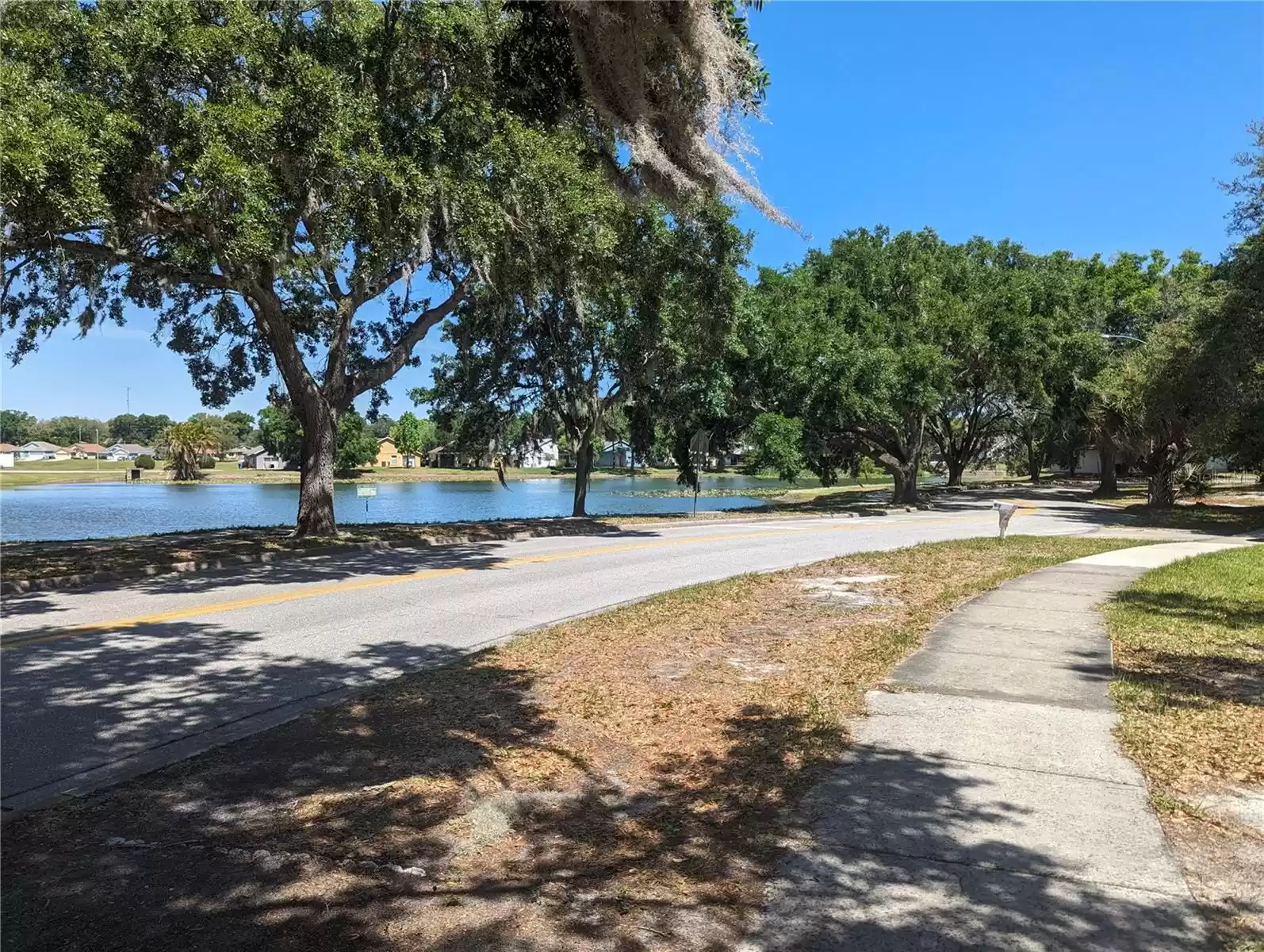 Sidewalks along the front of the home and the front of the lake