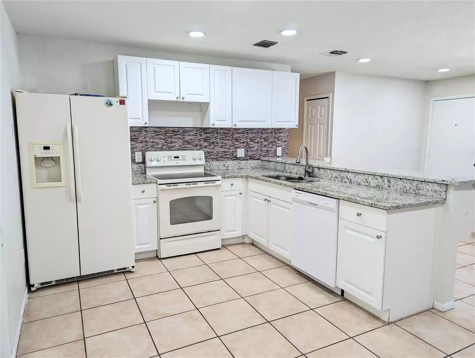 Upgraded kitchen with new cabinets and granite tops