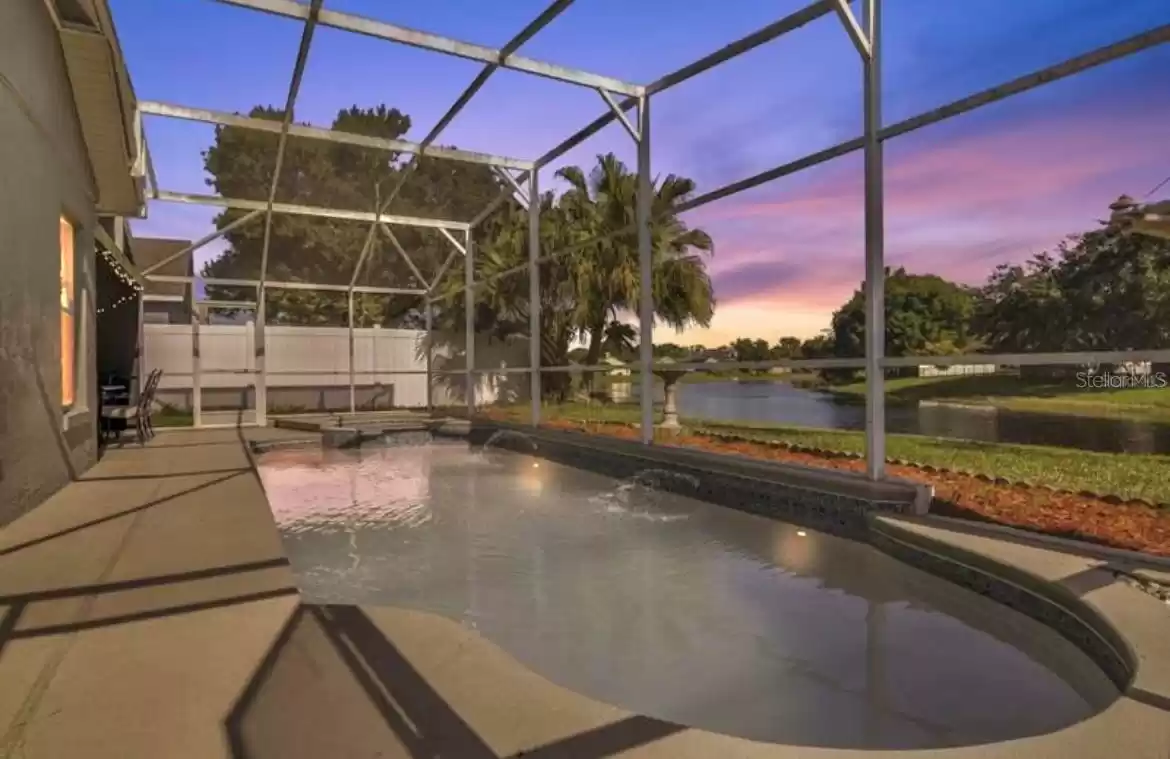 Enjoy entertaining with sunset evenings by the pool and plenty of yard space for a fire pit by the water with family and friends!!