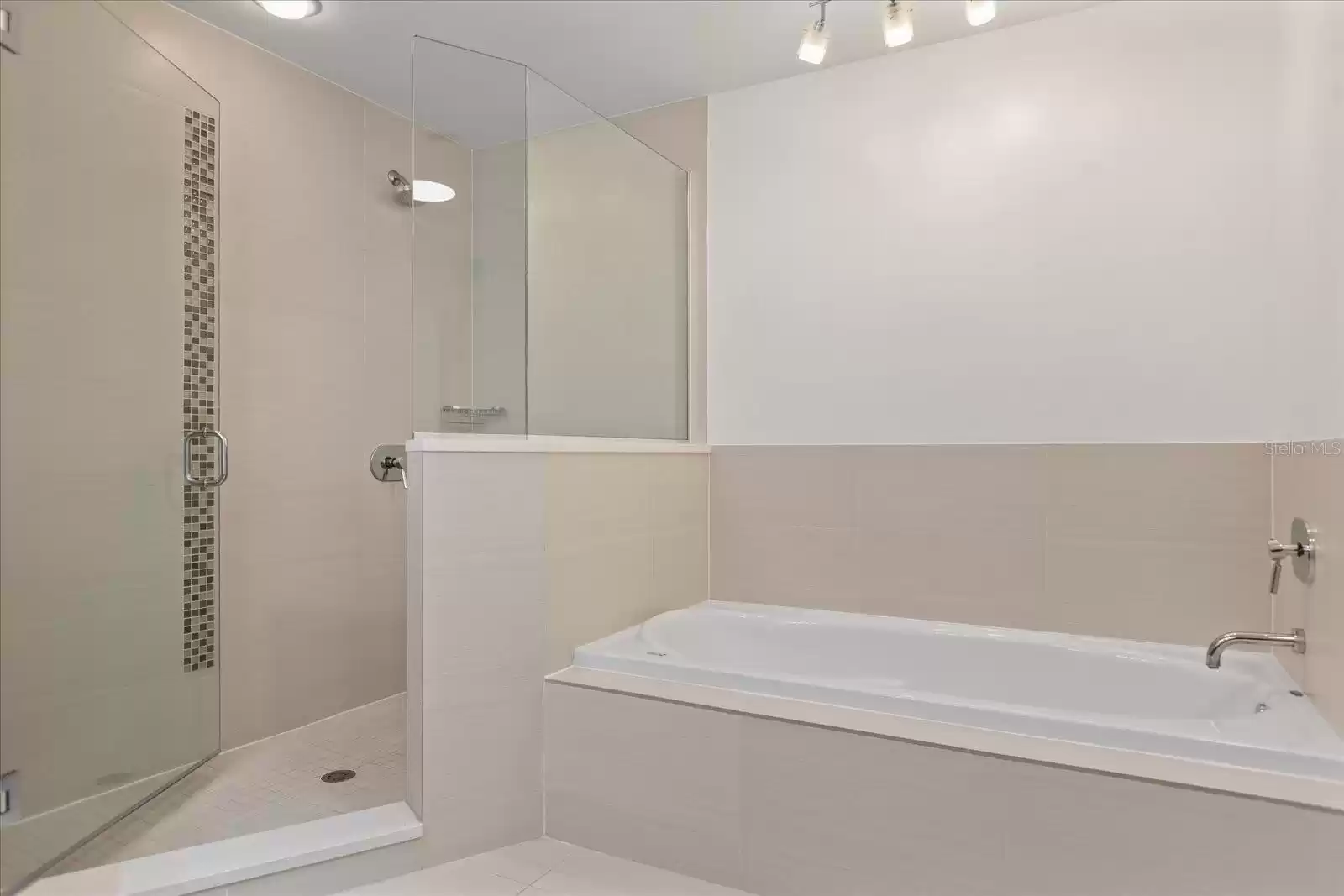 Master Bath, walk in shower. Neutral and light tile.