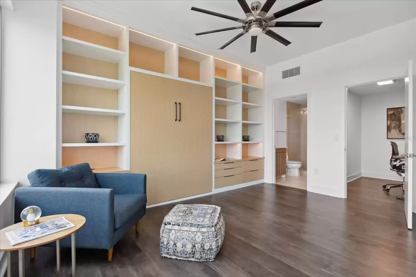 2nd bedroom, custom cabinetry murphy bed system, bathroom (left), and closet (right) serving as a home office currently.