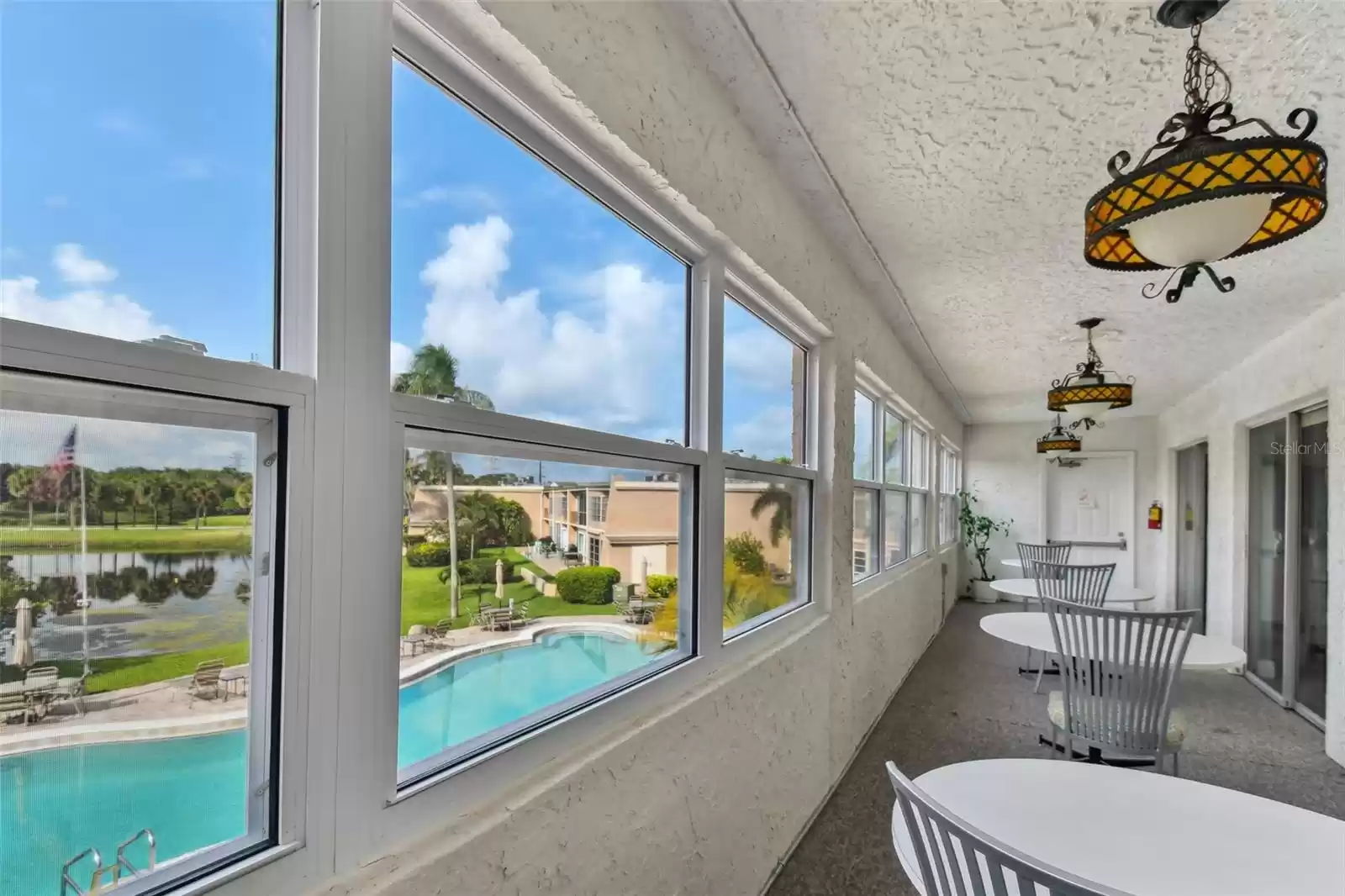 Clubhouse - Gathering Room overlooks swimming pool