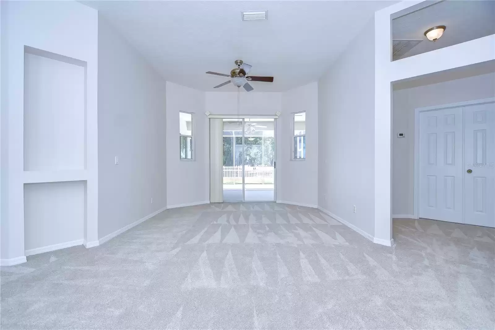 Formal living room with slider to lanai!