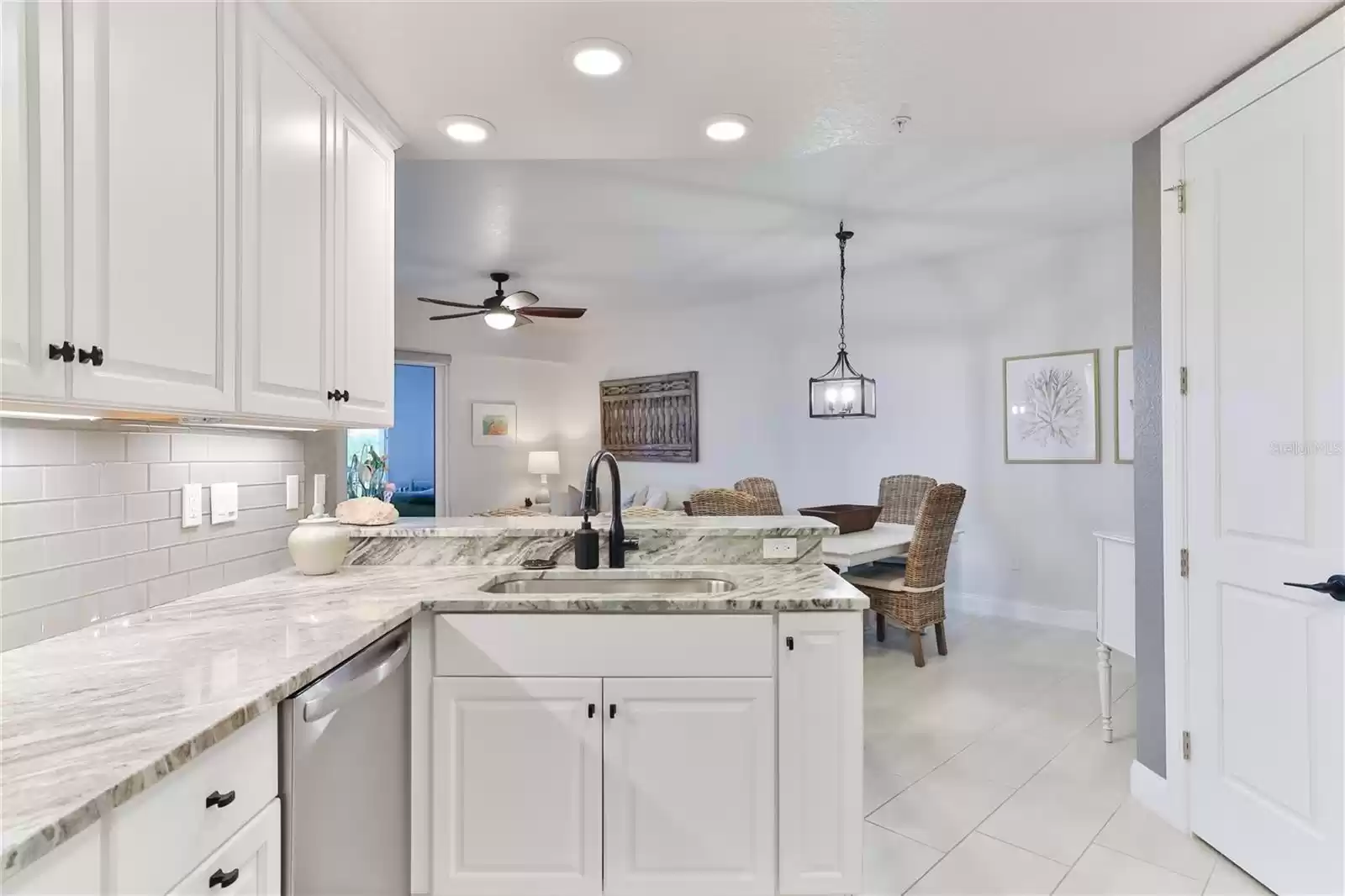 Luxurious Stone Counters and Glass Backsplash