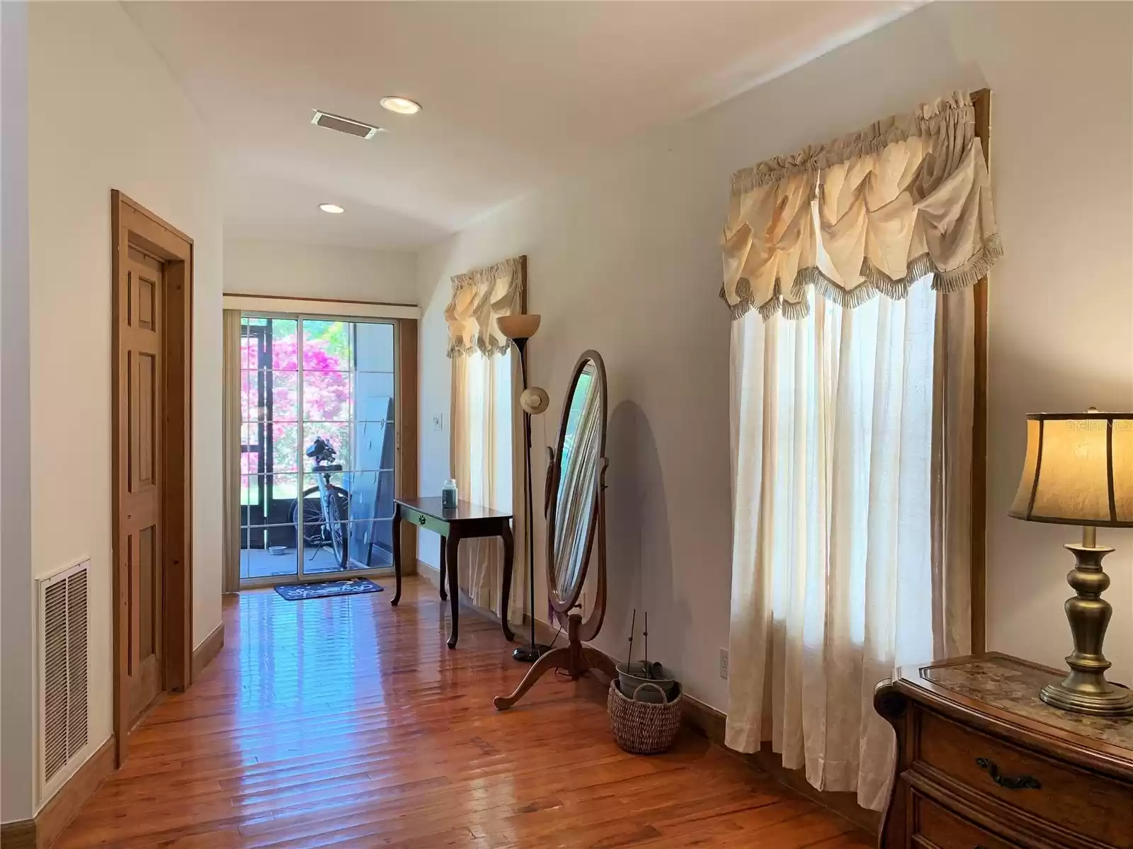 Glass sliding doors off of Master Bedroom to Private Back Screened Porch