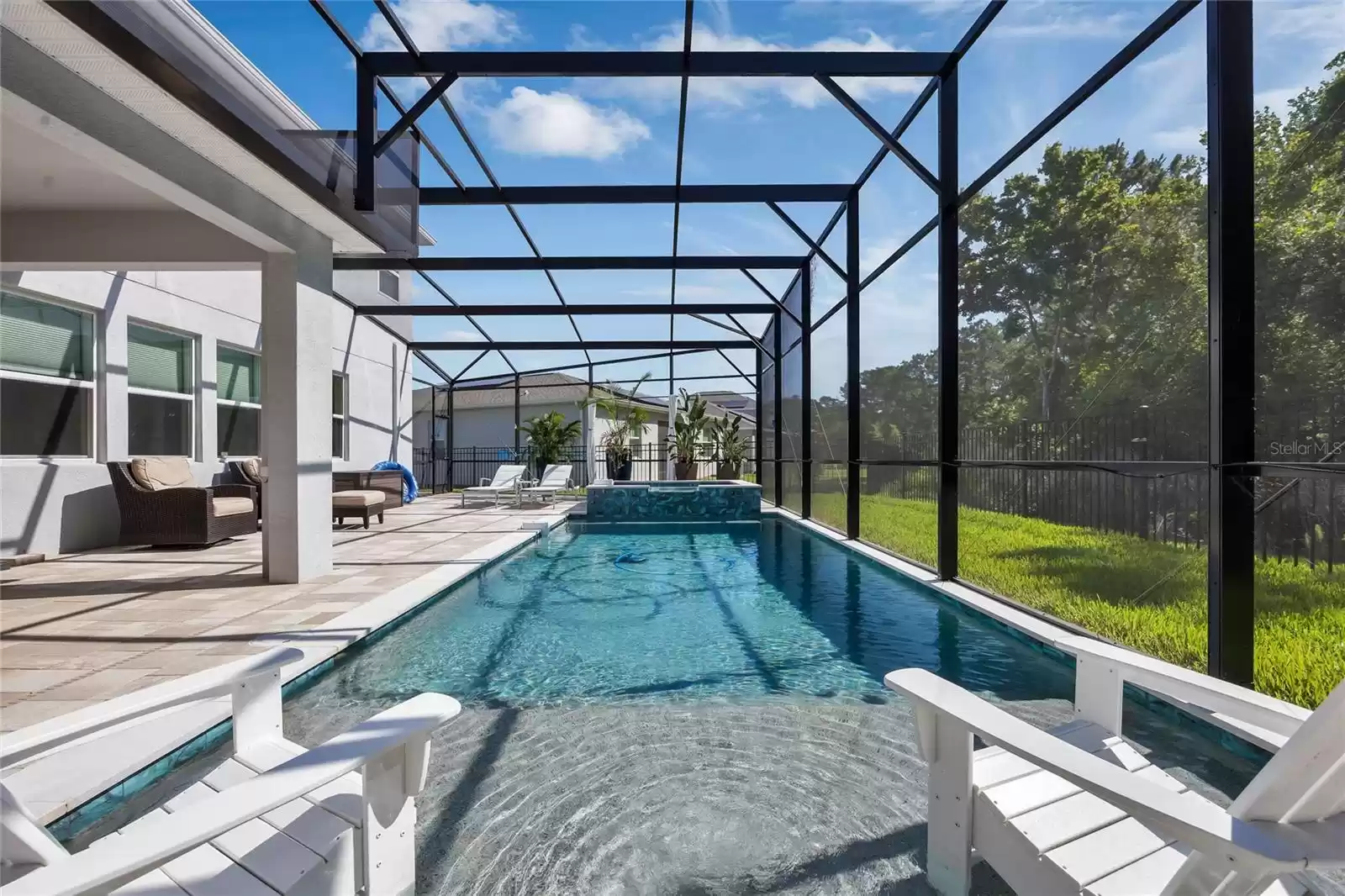 Spend the Summer poolside, cooking in your outdoor kitchen or relaxing on the sun shelf, all screened for maximum comfort with the beautiful WOODED VIEW.