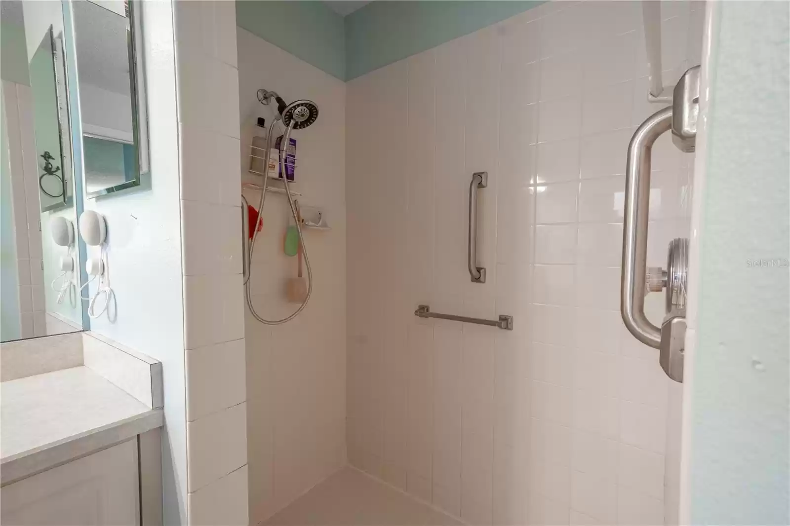 The primary bath features a tiled, walk in shower.