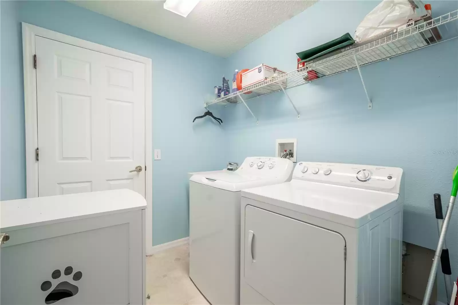 The Laundry room features a washer (new 2024) and dryer with shelving.