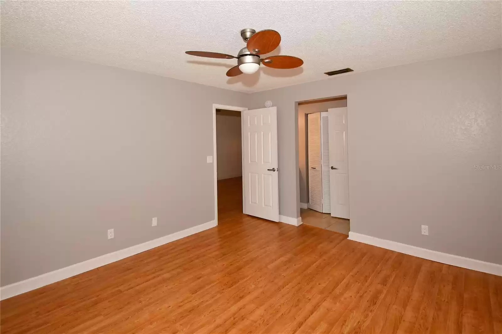 Primary Bedroom with walk in closet and ensuite bathroom