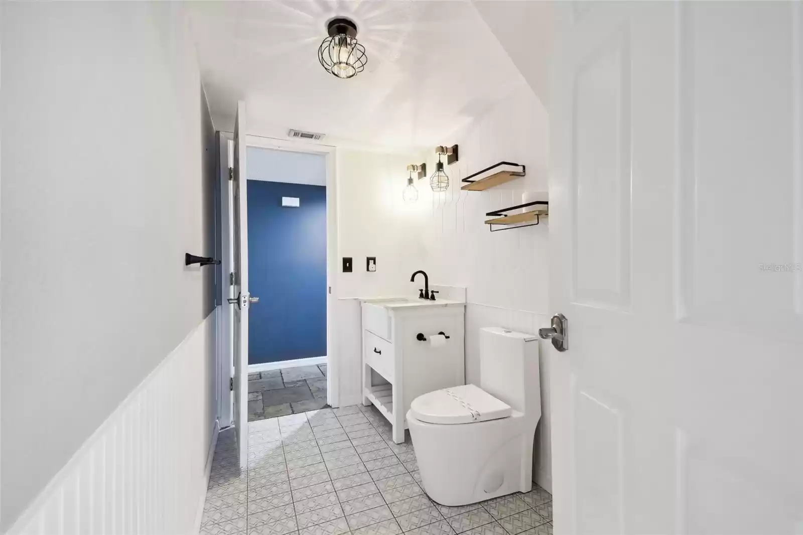 Half bath downstairs connected to bedroom