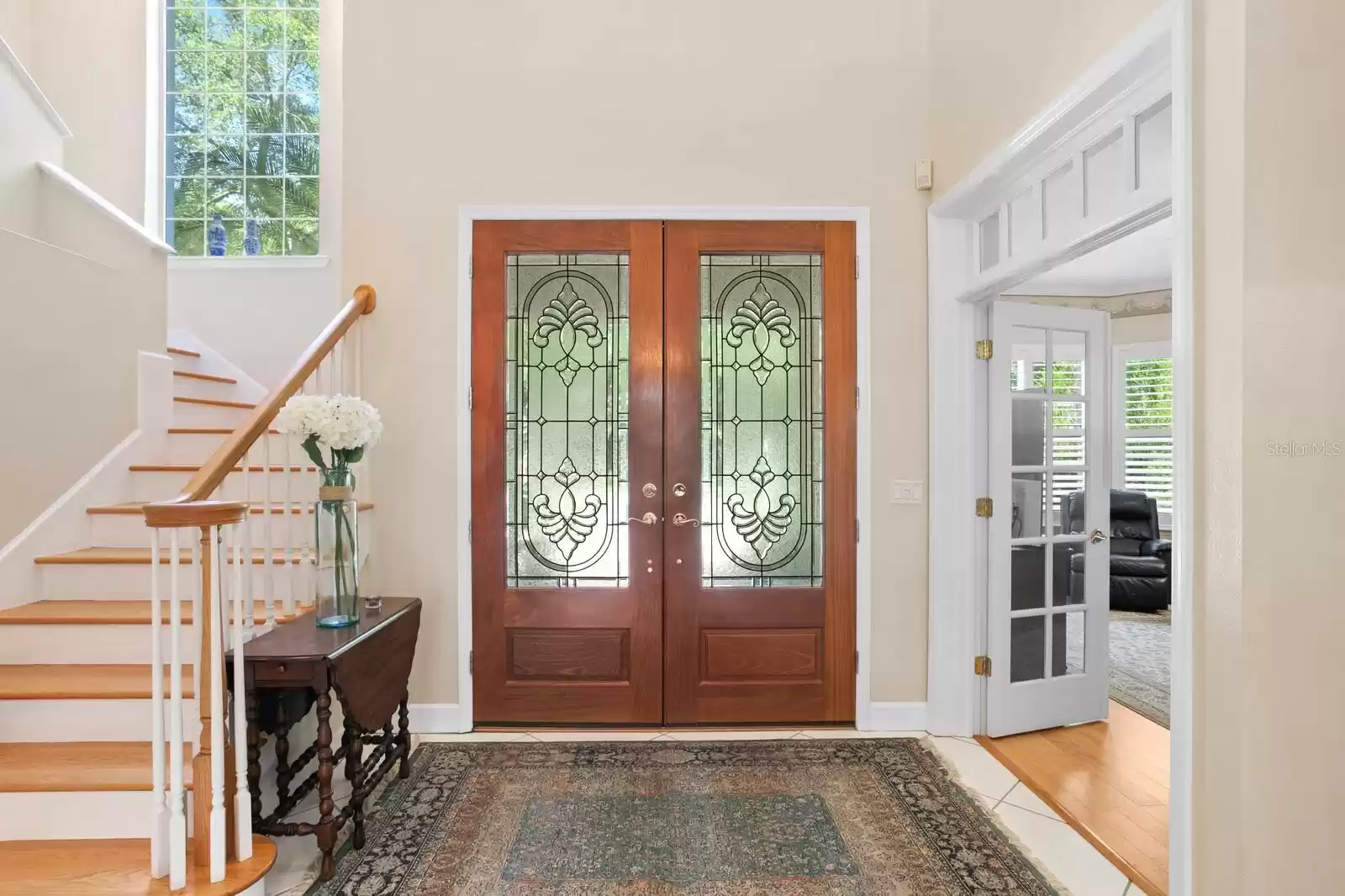 Foyer with First Staircase With Office on Right