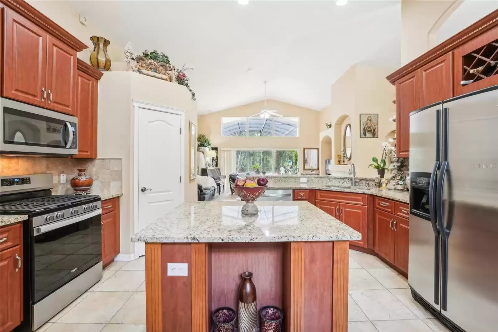 Kitchen island with view of pool area