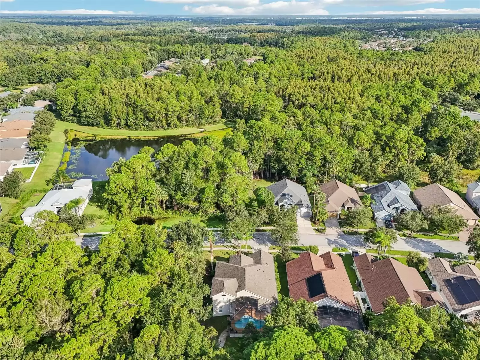 Aerial view of the property and community