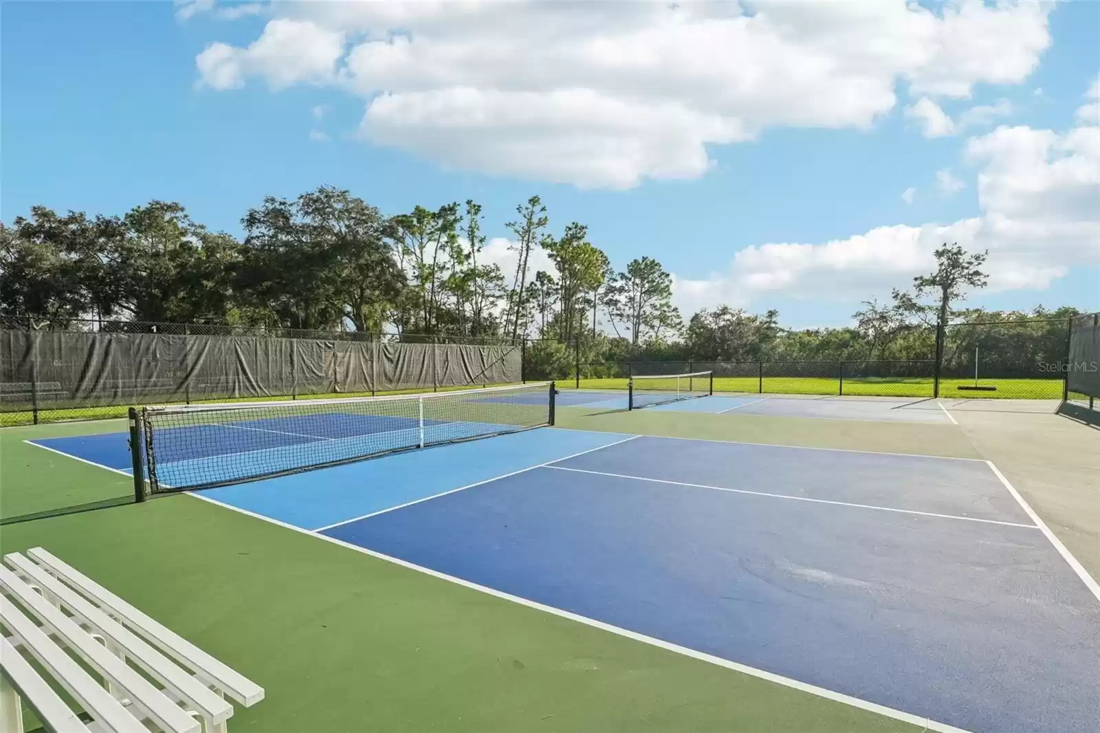 Community Club - Tennis courts with view of walking trail