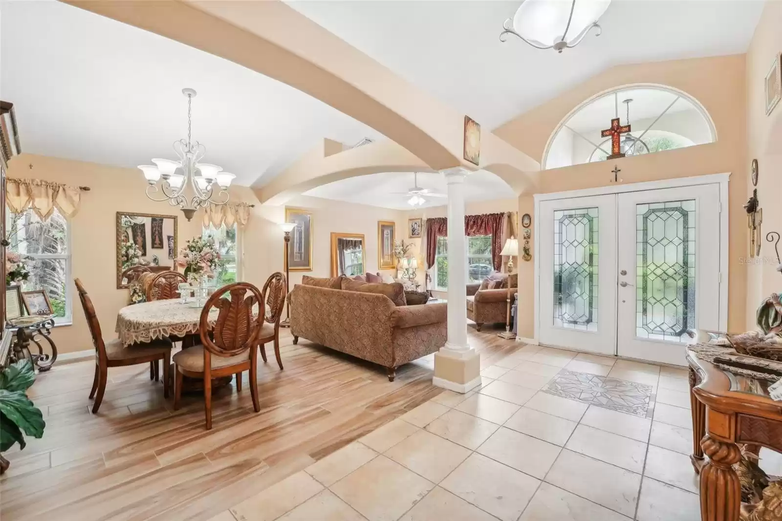 View of living and dinng room glass -double door in foyer