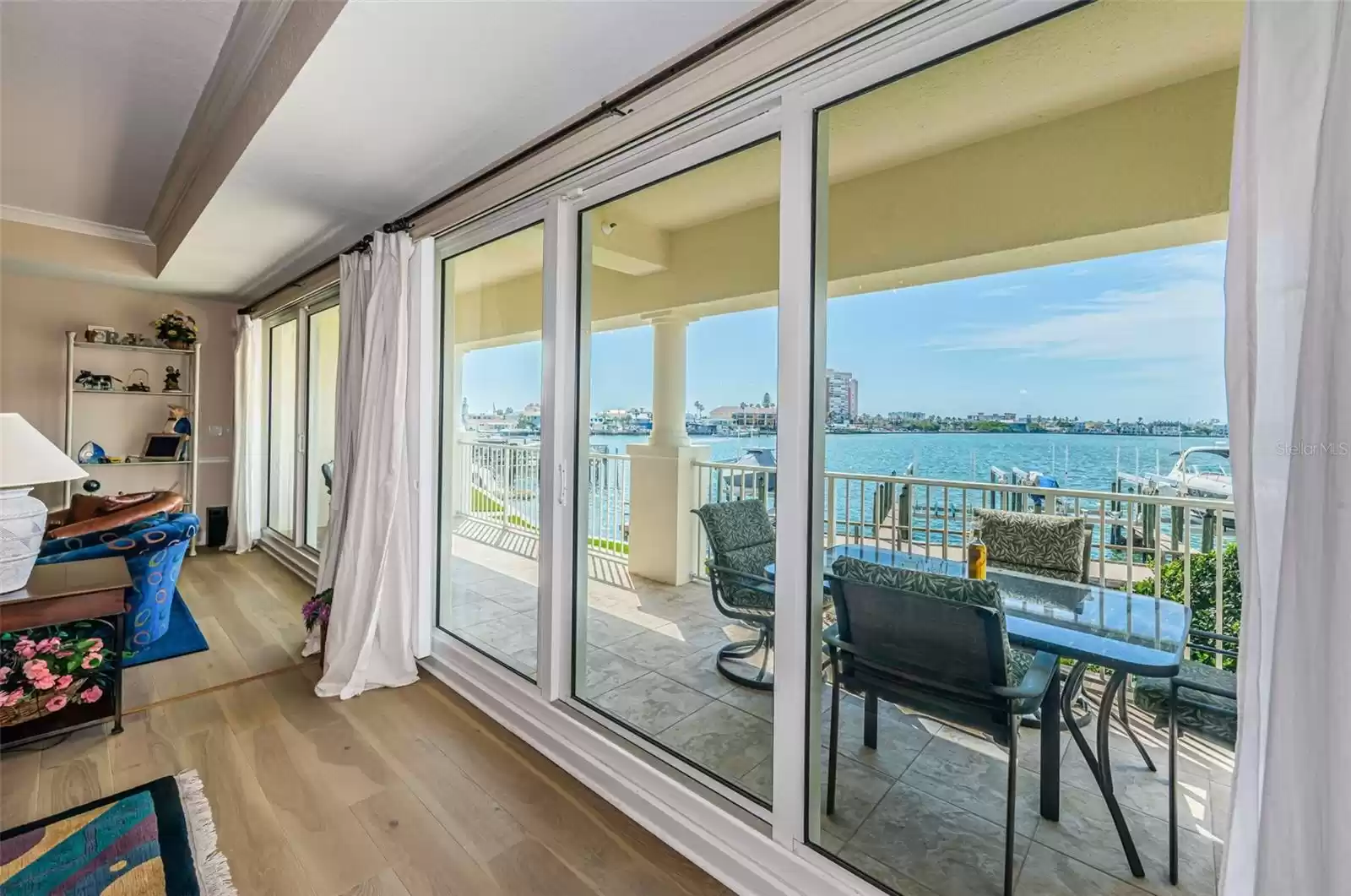 .. Great Room Lounging Area Looking out onto Waterfront Balcony.