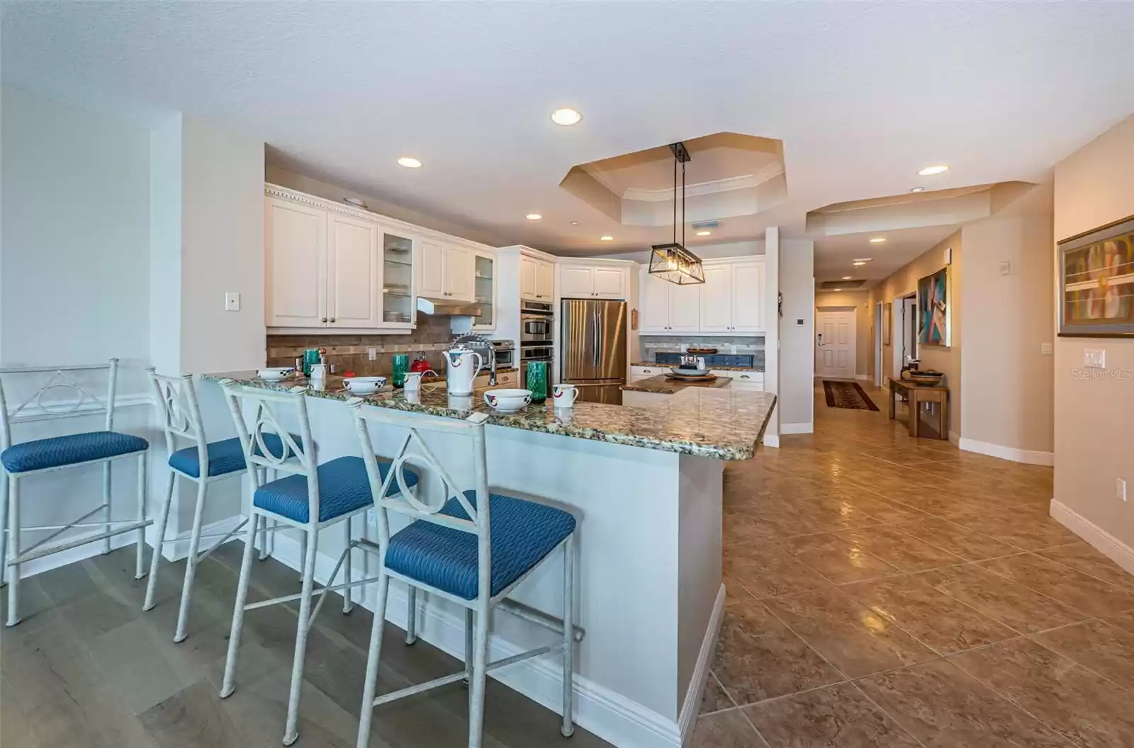 ... ..  Gourmet Kitchen with Tray Ceilings, Complete with Granite Countertops and Upscale Appliance Package.... Kitchen 10.3 Wide x 15.11 Long. Breakfast Bar With Stools..