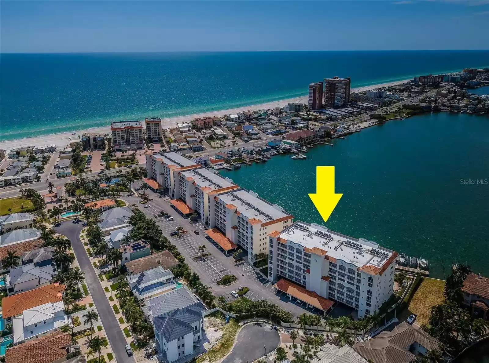 ..  Redington Shores Yacht & Tennis Club Consists  4 Condominium Building & about 88 Single Family Homes in a Secured 24 Hour Guard Gated Community located in Redington Shores Florida 33708. Arrow Over La Bahia Building Looking WNW.  Spectacular Long Range Views of the Boca Ciega Bay and the Gulf of Mexico in the background. This large body of Water attracts plenty of Marine Life. Dolphins bring their Young Calves here to practice Fishing Skills and to Swim on their own. Calves can stay with their Mothers for up to 3 to 5 Years.