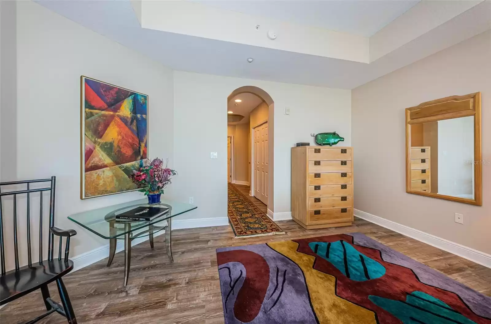 .. Master Bedroom Looking out to Hallway Towards His & Hers Closets and Bathroom.