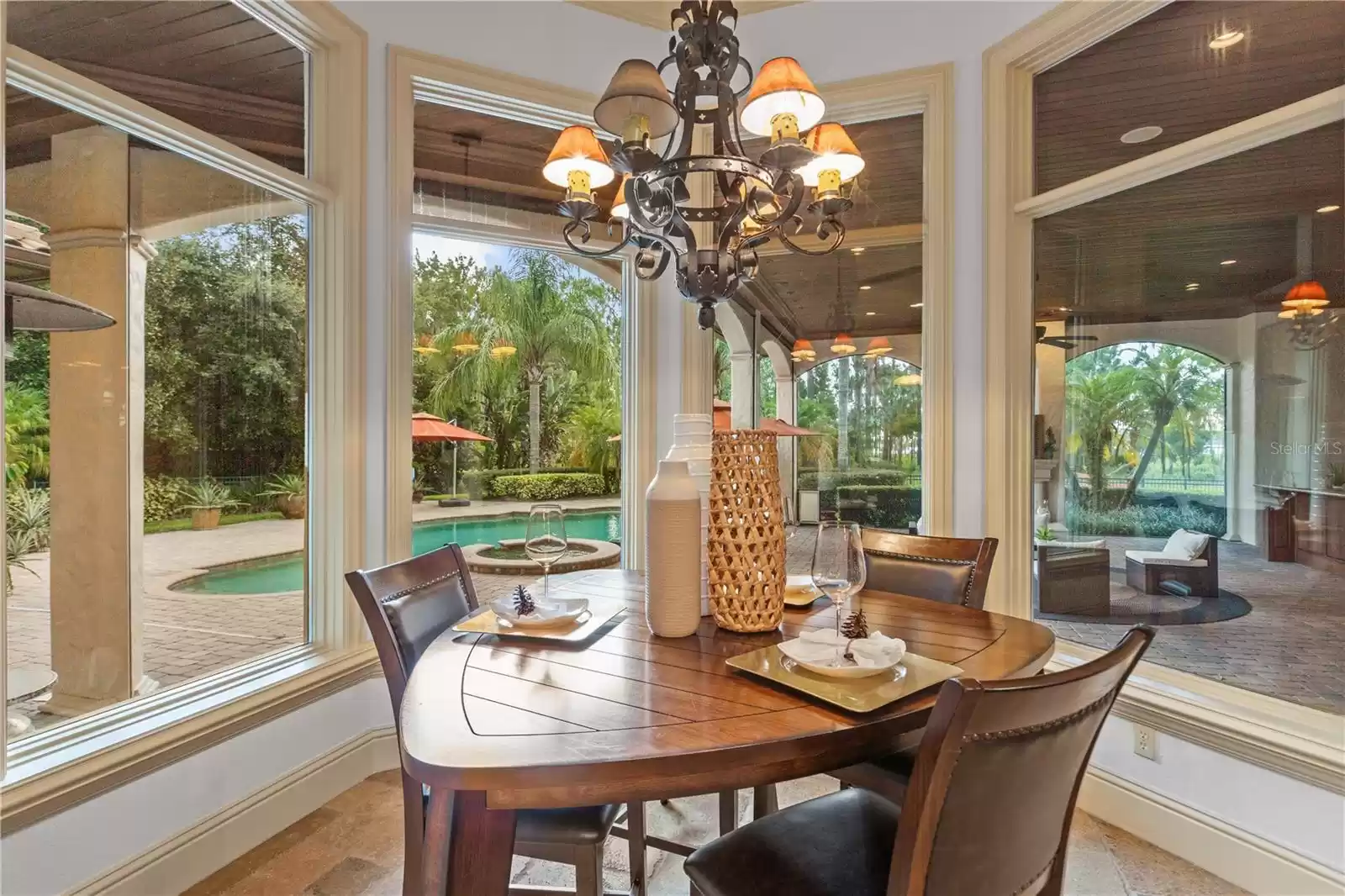 Spacious breakfast nook has pool view