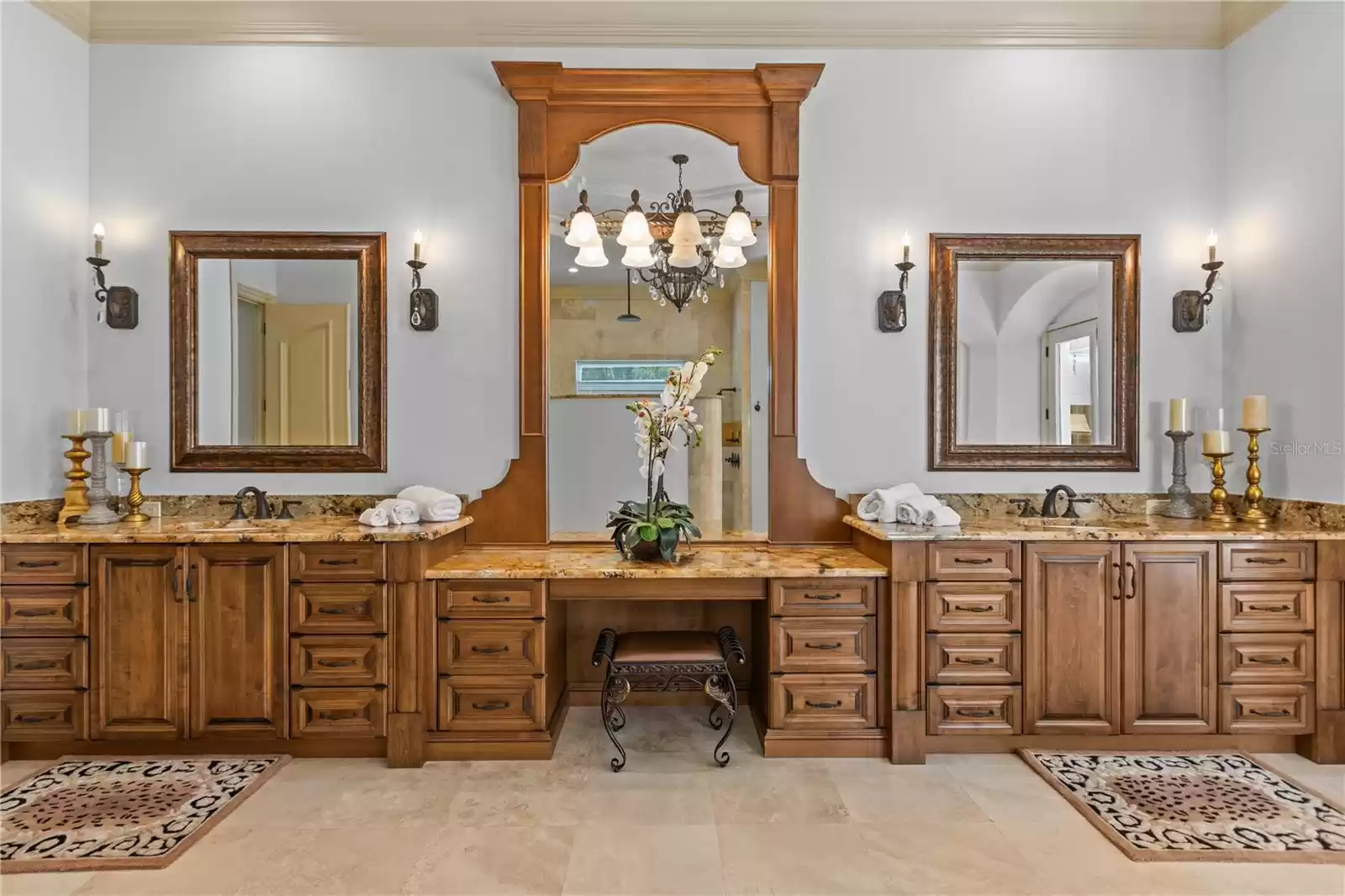 Lovely Primary vanity area flanked by dual sinks and spacious prep areas