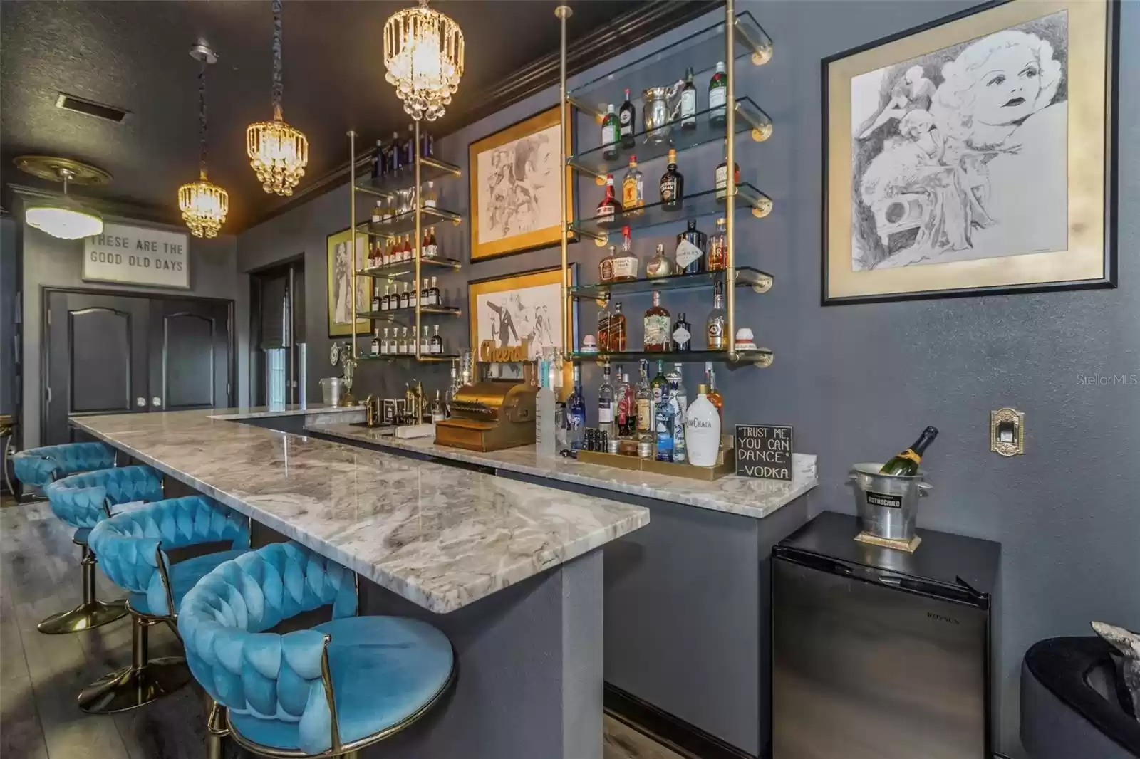 This home bar has granite counters, counter to ceiling glass shelving and fun or intimate seating areas - enough for a party of 1 or 20. Truly a charming pleasure!