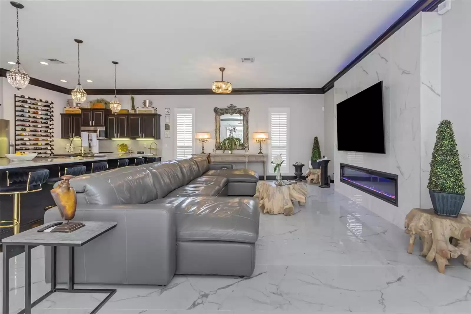 Living room with Bianco Onice Polished Porcelain tile floor and wall with 85