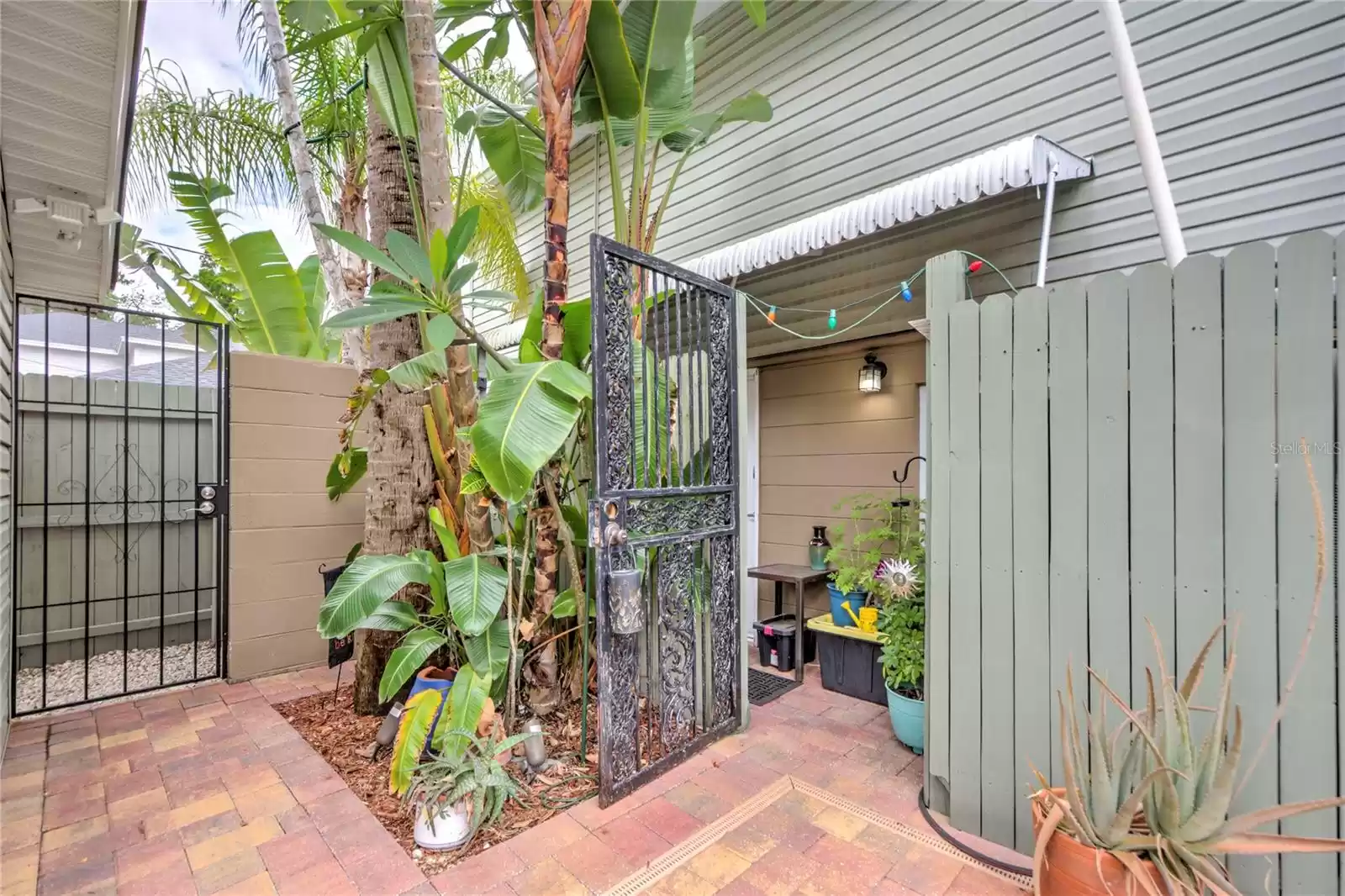 entrance gate from back parking area and entrance to 1 bedroom unit