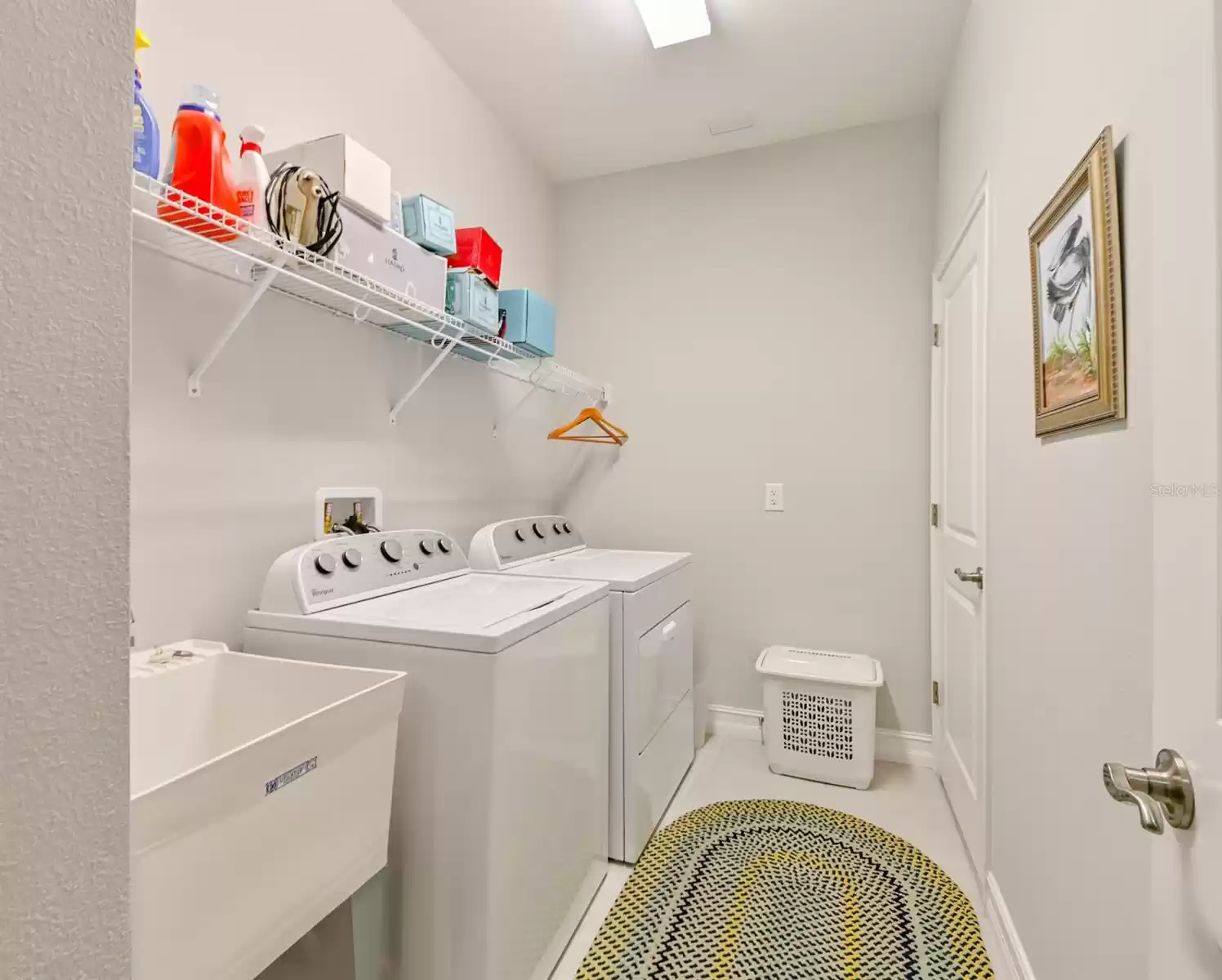 Laundry room with utility sink.  Washer and Dryer included.