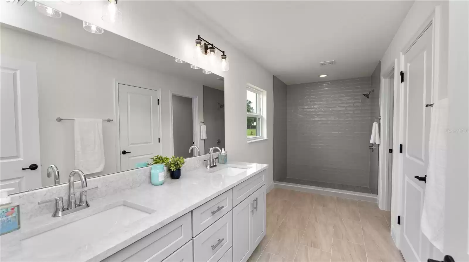 Primary suite- ensuite bathroom with double vanities