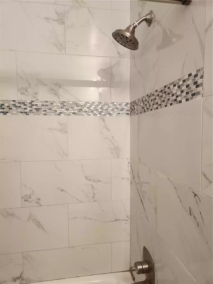 Check out the tile work in guest bathroom!