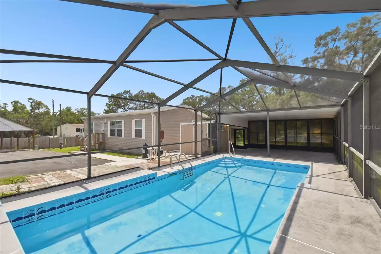 Pool House with Large Enclosed Pool with Covered Lanai and Full Bath.