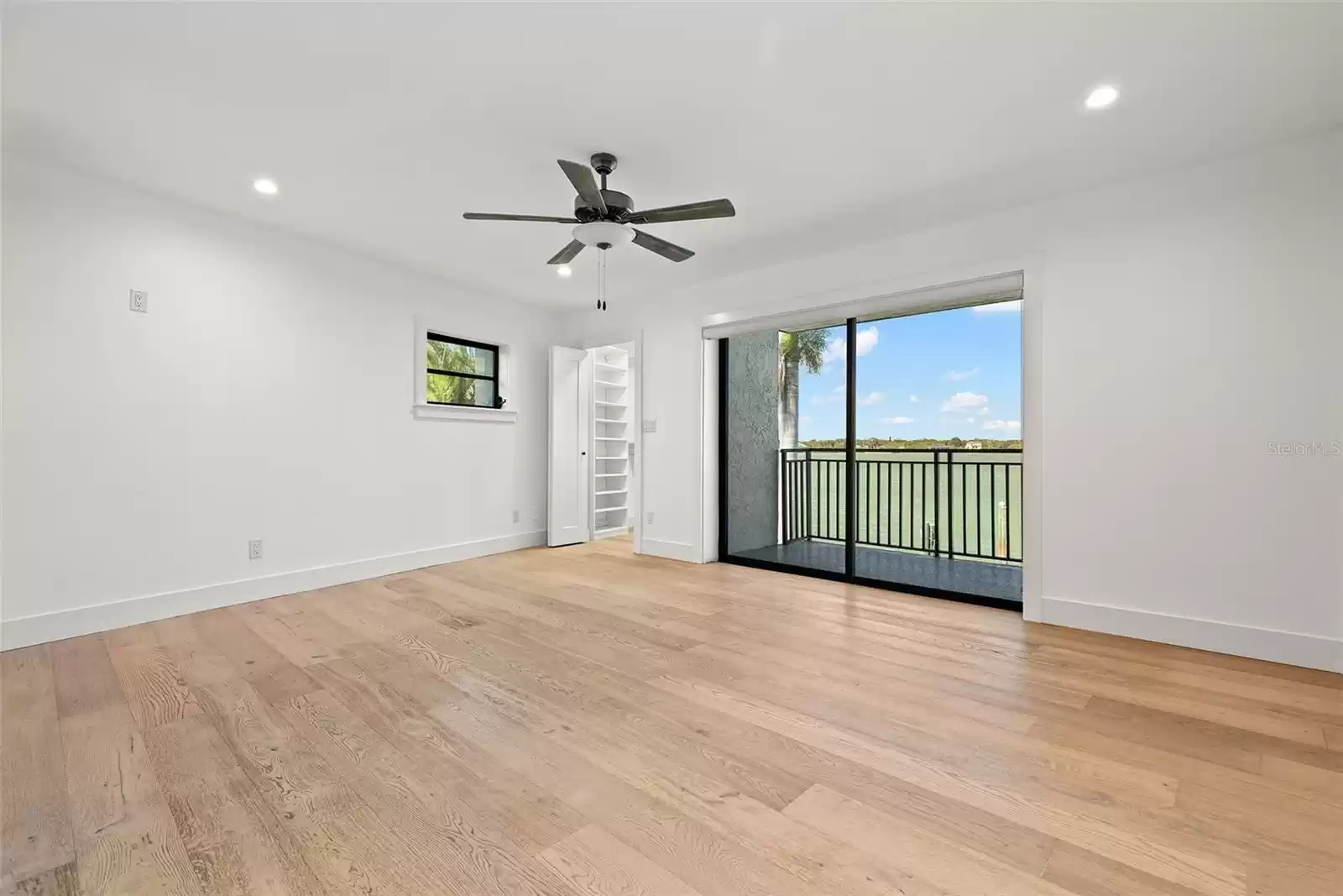 Primary Bedroom with access to balcony