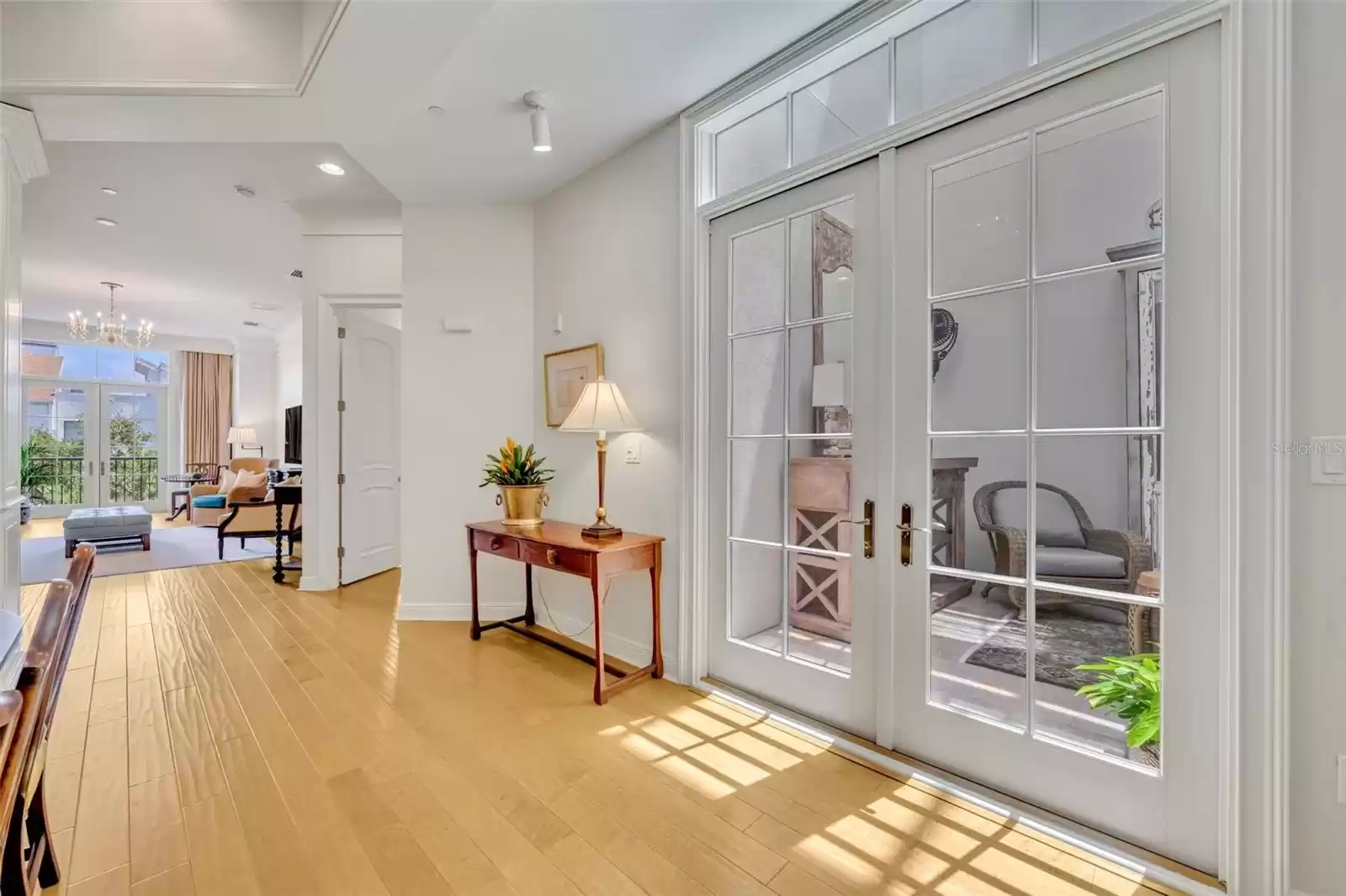 French doors lead to the sunny atrium off the dining area