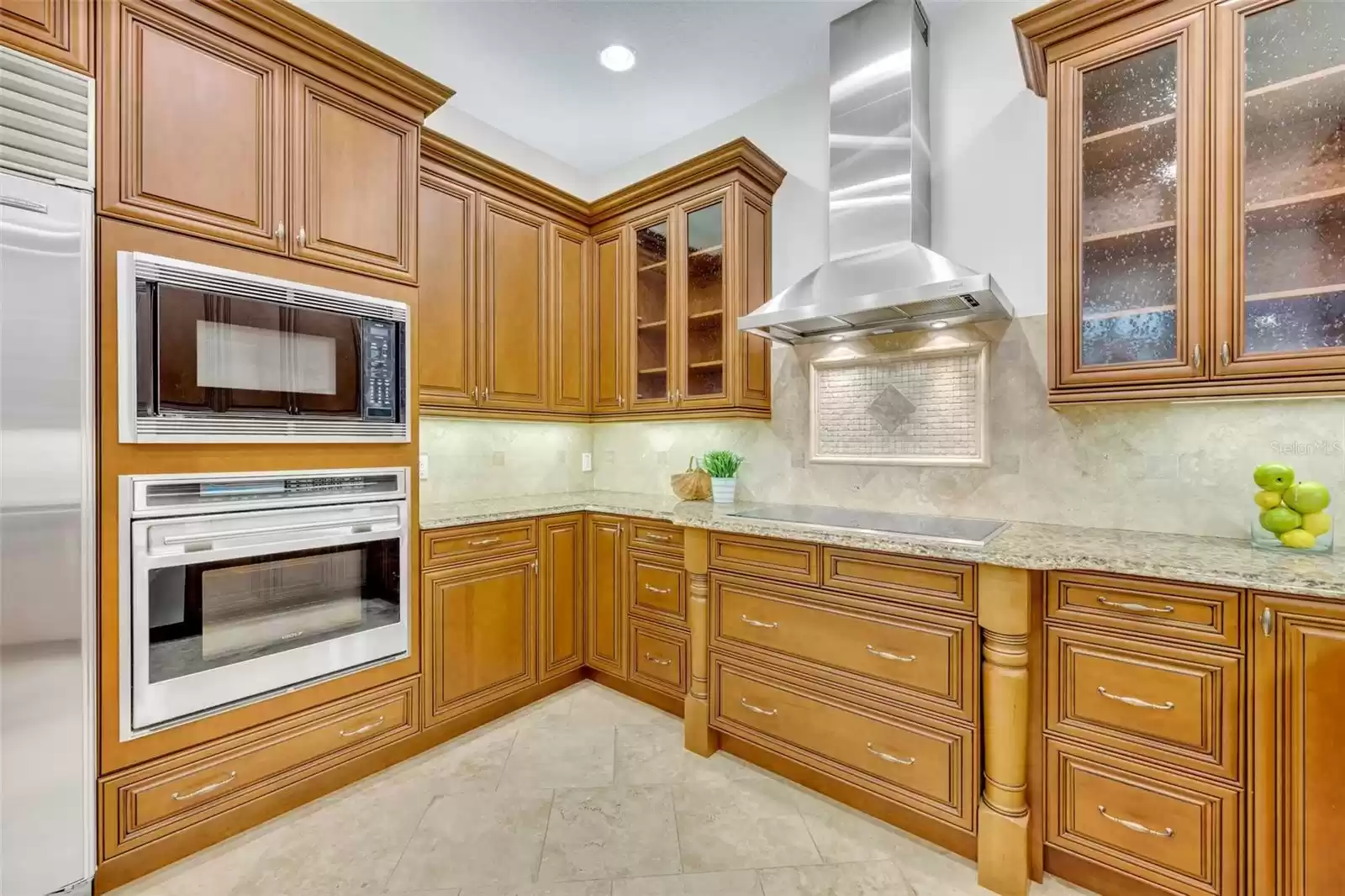 Kitchen- tons of storage with custom pullouts installed in various cabinets