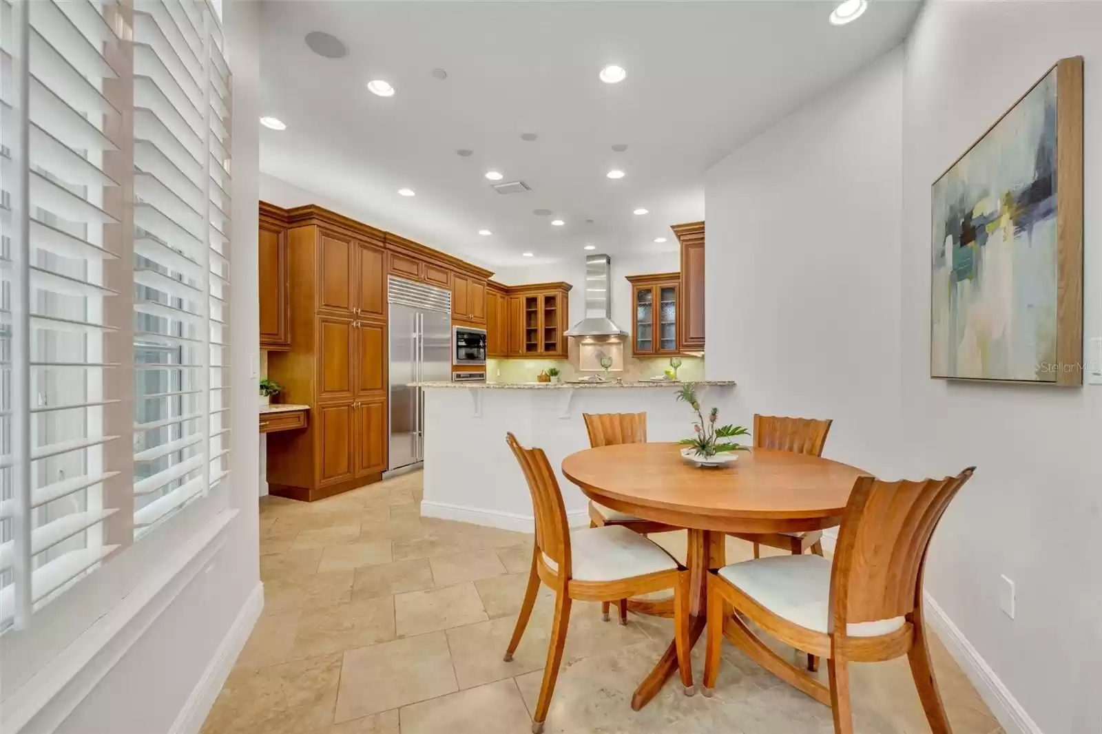 Dinette area in kitchen with atrium views