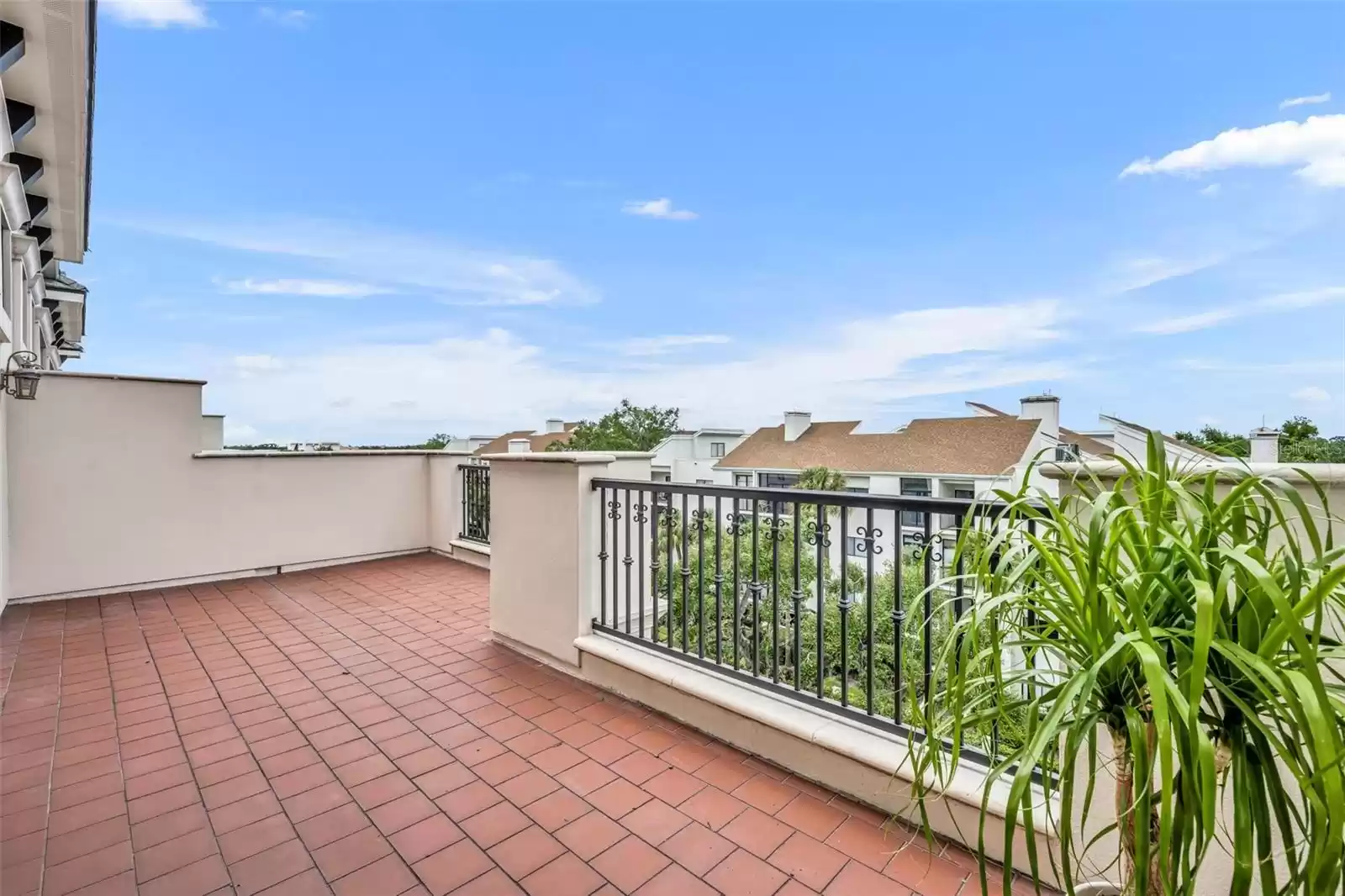 Balcony off Primary Suite spans 26 feet wide- overlooking treetops on Morse